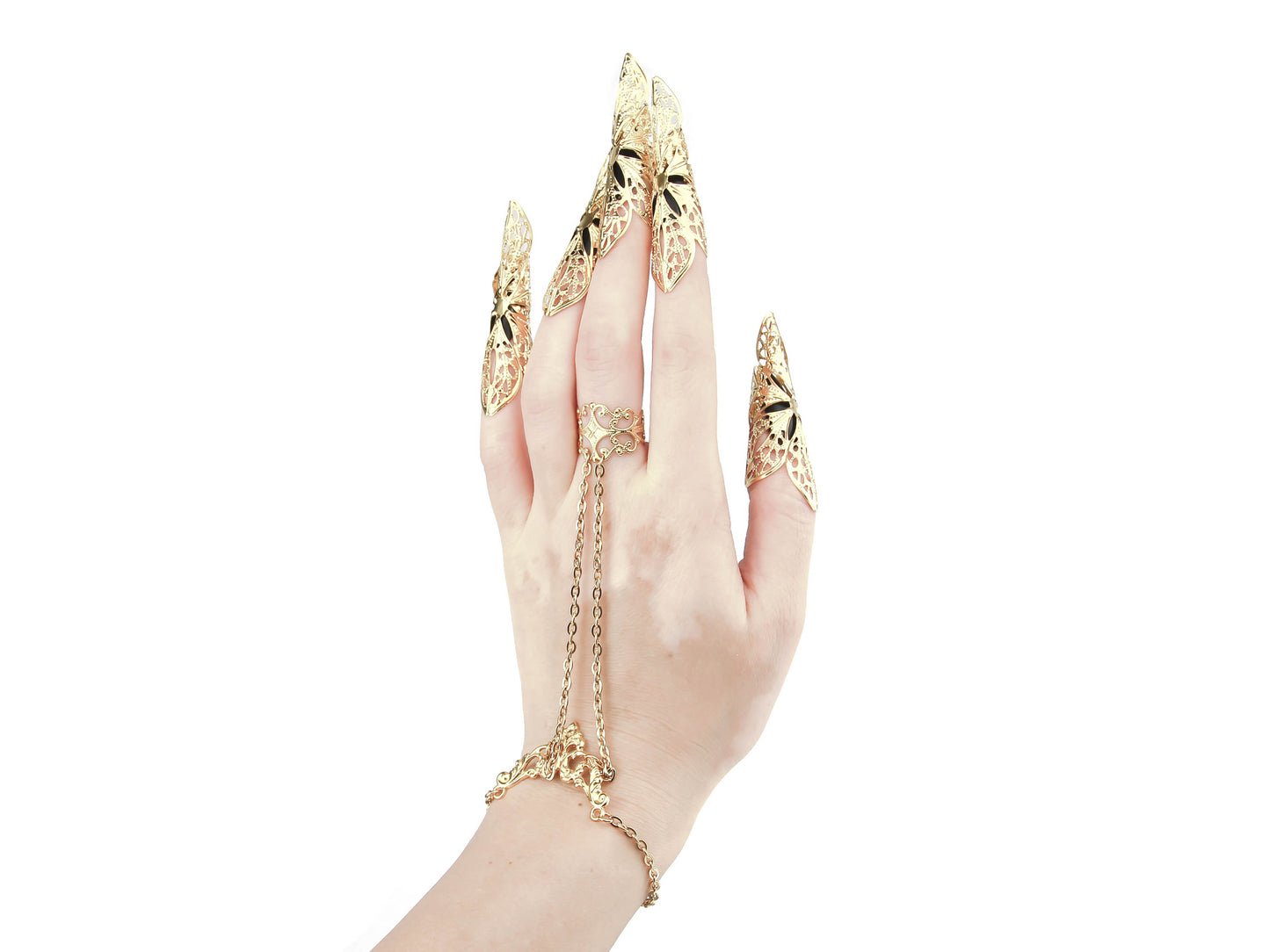 Discover Myril Jewels' hand chain bracelet ring, intricately linked to long, filigree nail claw rings. This handcrafted dark avant-garde jewelry, with its gothic-chic design, makes a bold statement for those embracing a Neo Gothic lifestyle. Ideal for Halloween, everyday wear, or as a standout accessory at rave parties and festivals, it's a must-have for aficionados of Witchcore and minimal goth fashion, offering an unparalleled fusion of edginess and elegance