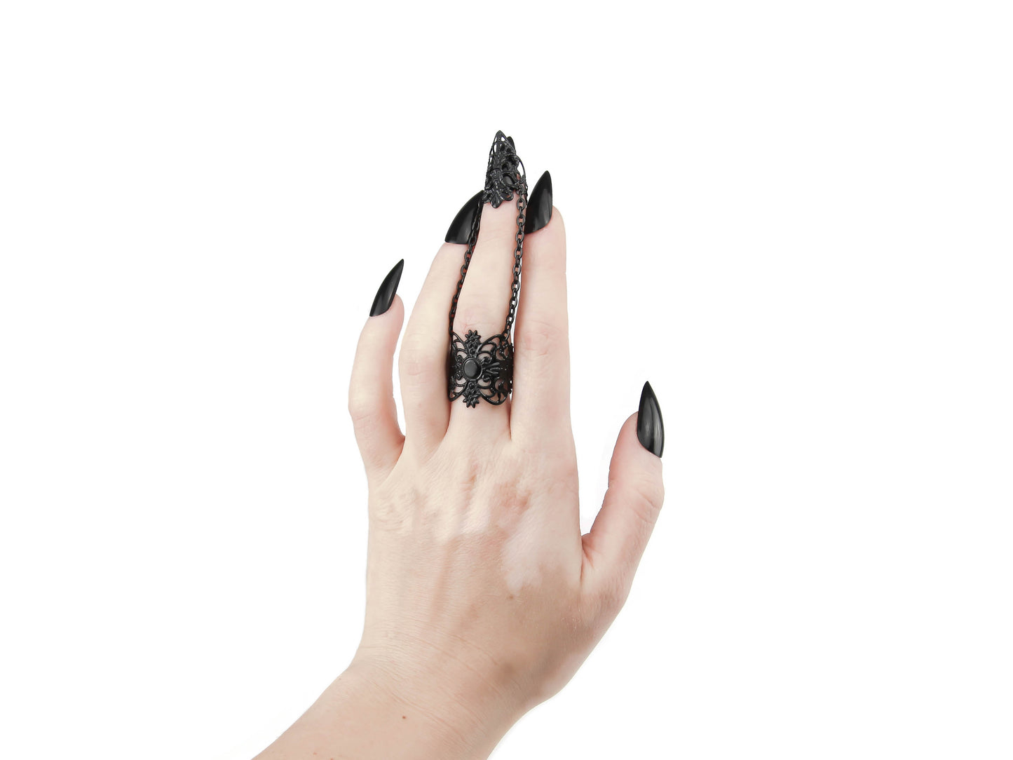 This image captures a striking black claw ring from Myril Jewels, elegantly worn on the middle finger. The ring's intricate, dark design epitomizes the brand's neo-goth aesthetic, perfect for Halloween, punk styles, and witchcore enthusiasts. It's an ideal piece for gothic-chic expressions, rave parties, or as a bold jewelry choice for everyday wear, making it a unique goth girlfriend gift or a daring accessory for anyone who loves standout, handcrafted jewelry.
