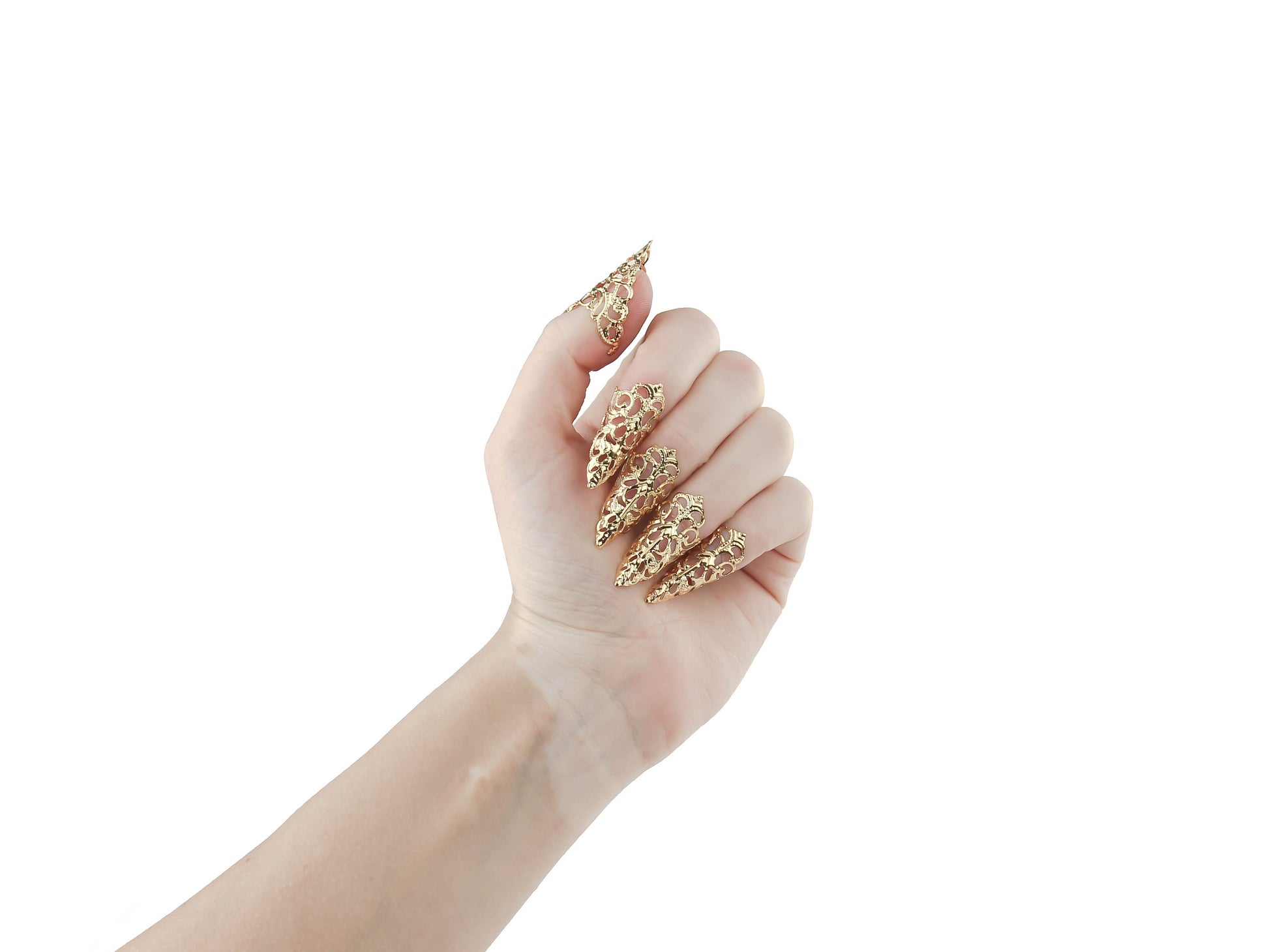 A hand gracefully showcases Myril Jewels' goth gold nail rings, featuring delicate filigree claws. These unique pieces are ideal for adding a touch of neo-gothic sophistication to any outfit, perfect for daily wear or as a statement accessory at a whimsigoth event or festival.