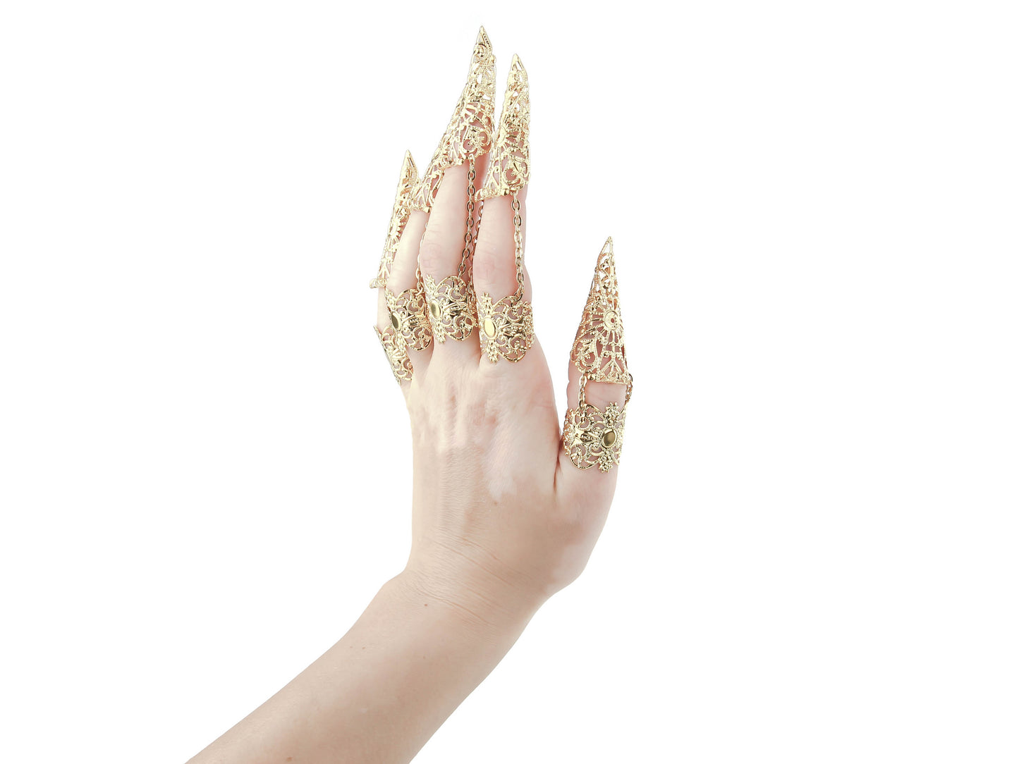 A hand elegantly displays Myril Jewels' full set of intricate gold rings with nail claws, perfect for neo-gothic style enthusiasts. The exquisite craftsmanship is ideal for Halloween, punk fashion statements, or as a standout accessory for whimsigoth and witchcore looks, also making a memorable gift for a goth girlfriend.