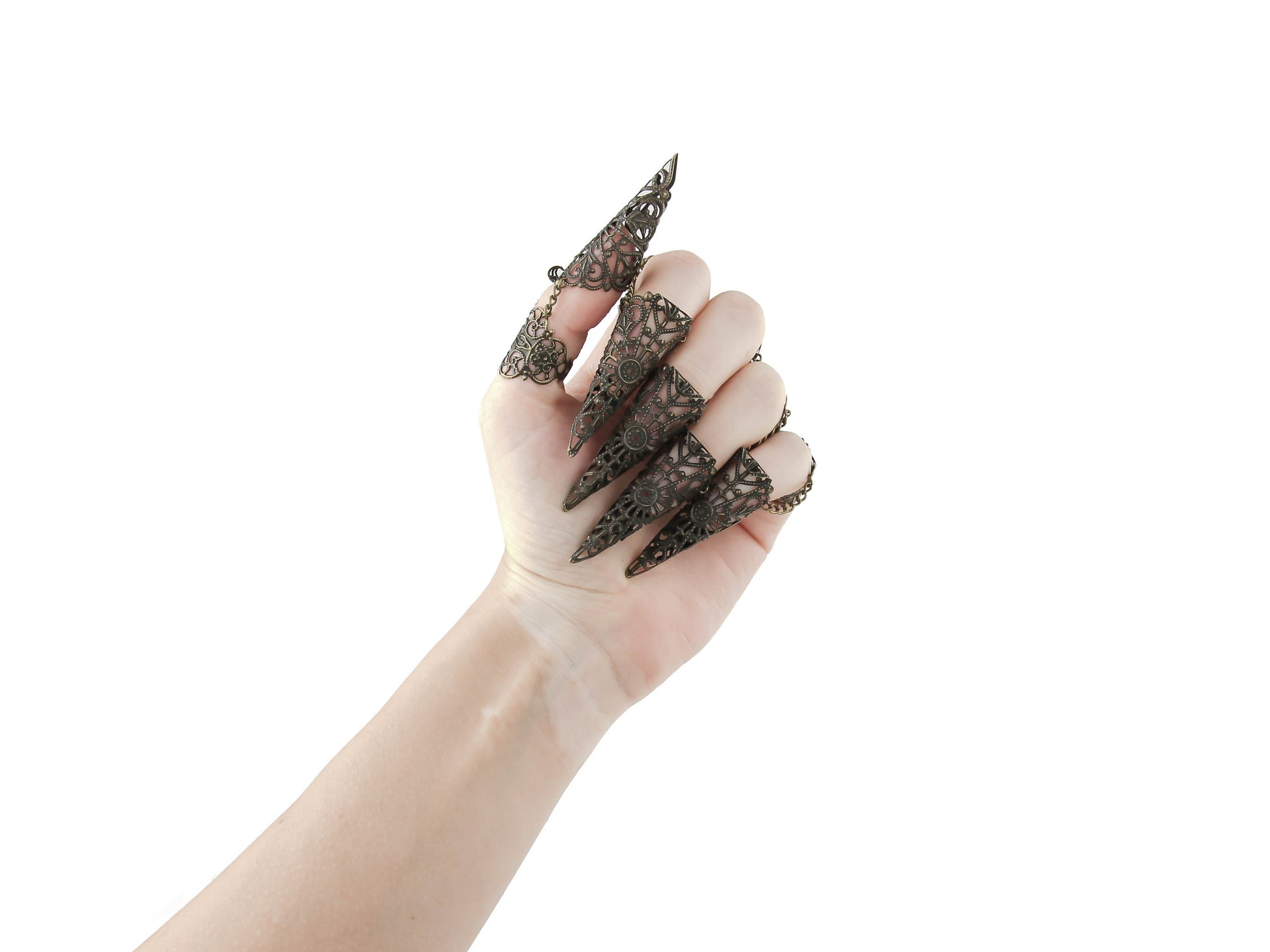 Unveil your inner goth with Myril Jewels' full hand set of intricate bronze rings, each culminating in a striking nail claw. These neo-gothic treasures, perfect for Halloween, embody a bold statement for punk jewelry lovers and those with a witchcore flair, offering a unique touch to any drag queen jewel collection or as a standout goth girlfriend gift