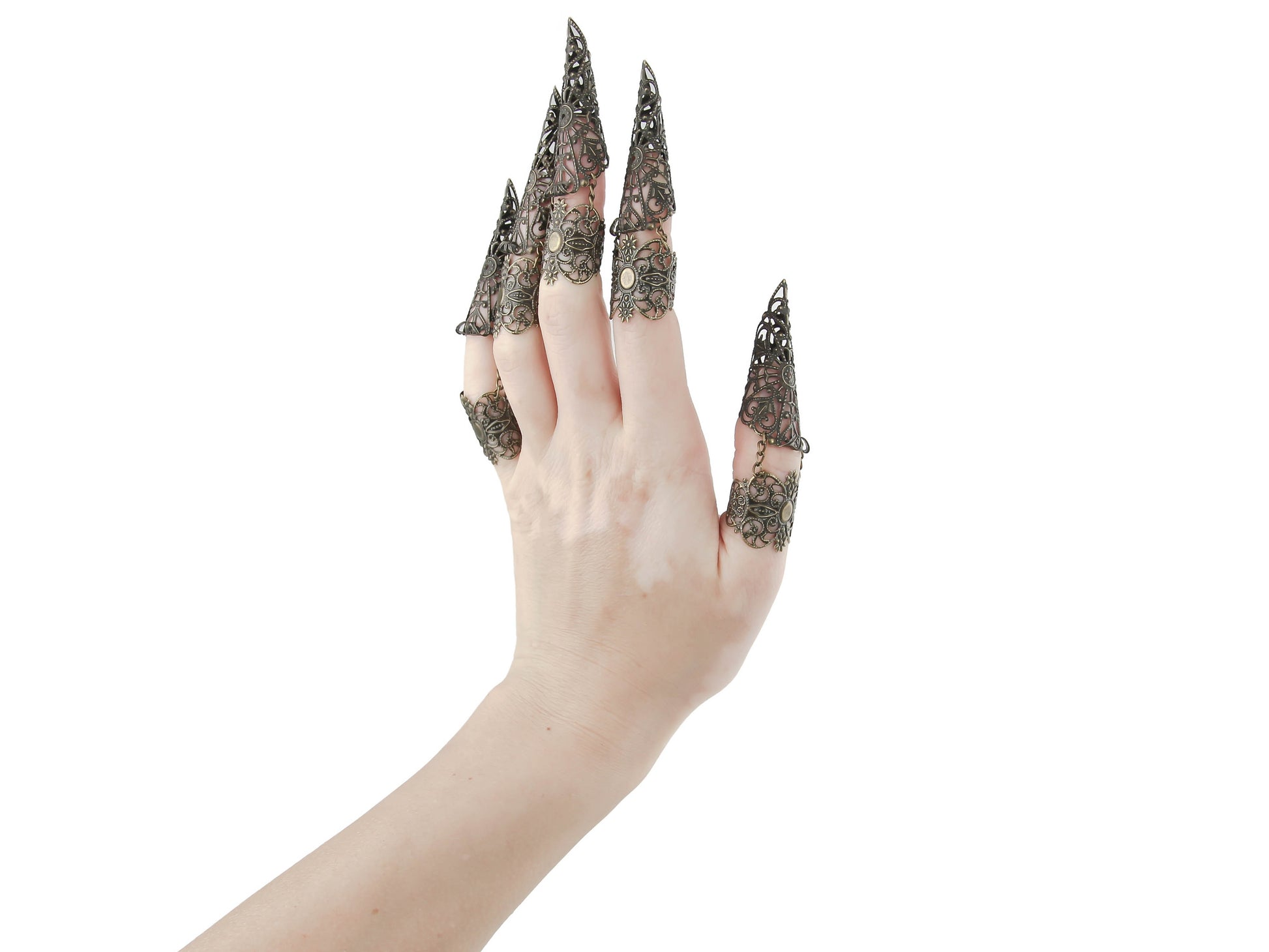 Showcase the striking allure of Myril Jewels with this full hand set of bronze midi rings, each ring extending into an elegant claw design. The intricate detail reflects a neo-gothic aesthetic, perfect for the gothic and alternative style connoisseur. These rings are an impeccable choice for Halloween, embodying the essence of punk jewelry and witchcore. They serve as an avant-garde statement piece, ideal for minimal goth everyday wear or as a dramatic accessory for rave parties and festivals
