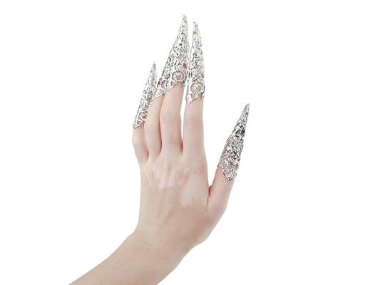 A hand models a full set of Myril Jewels' extra-long nail claws, exuding neo-gothic elegance. Designed for lovers of dark, avant-garde fashion, these claws are perfect for Halloween, punk looks, and witchcore enthusiasts. They make a bold statement for everyday wear, rave parties, and festivals, and are an unforgettable gift for the goth girlfriend.