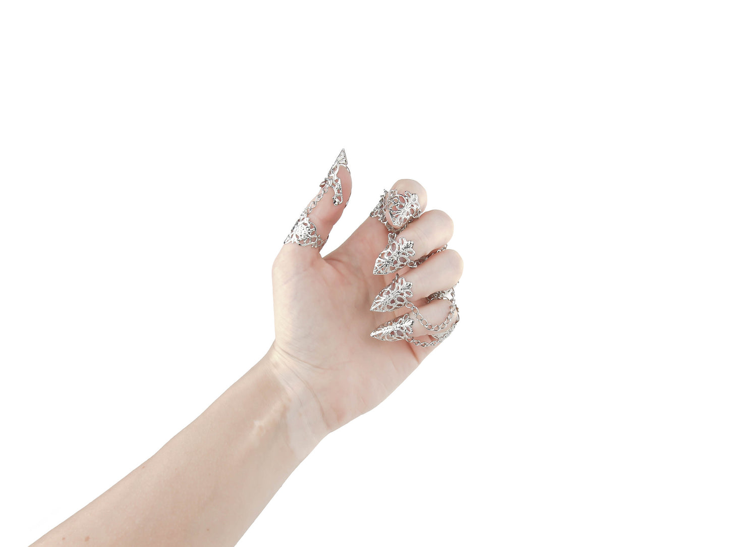A full hand adorned with Myril Jewels' ornate rings, each finger capped with an elegant nail claw. These pieces capture the essence of dark-avantgarde style, ideal for a neo-gothic look or adding a dramatic touch to witchcore and whimsigoth outfits, perfect for festivals or as a unique goth girlfriend gift.