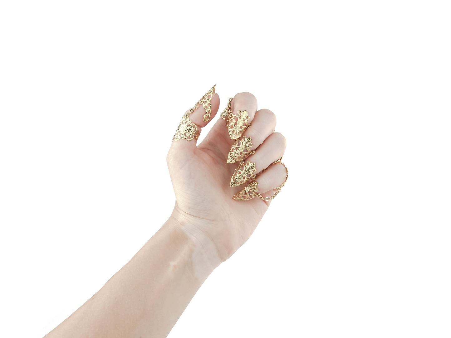 A hand is adorned with a striking set of gold claw rings from Myril Jewels, featuring detailed neo-gothic designs perfect for individuals who embrace gothic and alternative styles. These claw rings serve as an eye-catching addition for Halloween, complementing punk and gothic-chic wardrobes, and add an edgy touch to minimal goth or witchcore daily attire. They are also ideal for enhancing rave party outfits, festival looks, or as a unique gift for a goth girlfriend.
