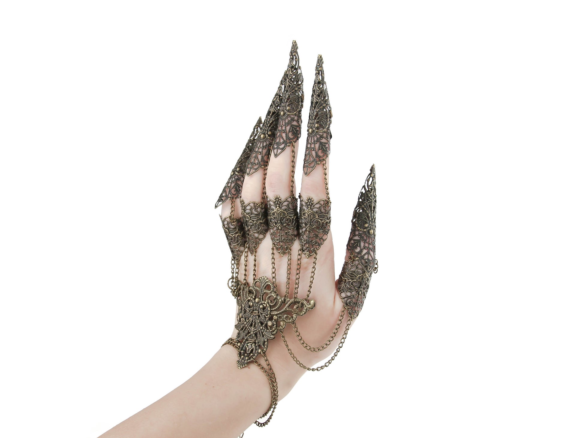 An intricate gothic claw glove crafted with a delicate bronze filigree, epitomizing dark fashion elegance. Each finger extends into a fine, clawed tip, perfect for goth jewelry enthusiasts seeking a dramatic accessory. The glove's chain links and lace-patterned metalwork enhance its ornate appeal.