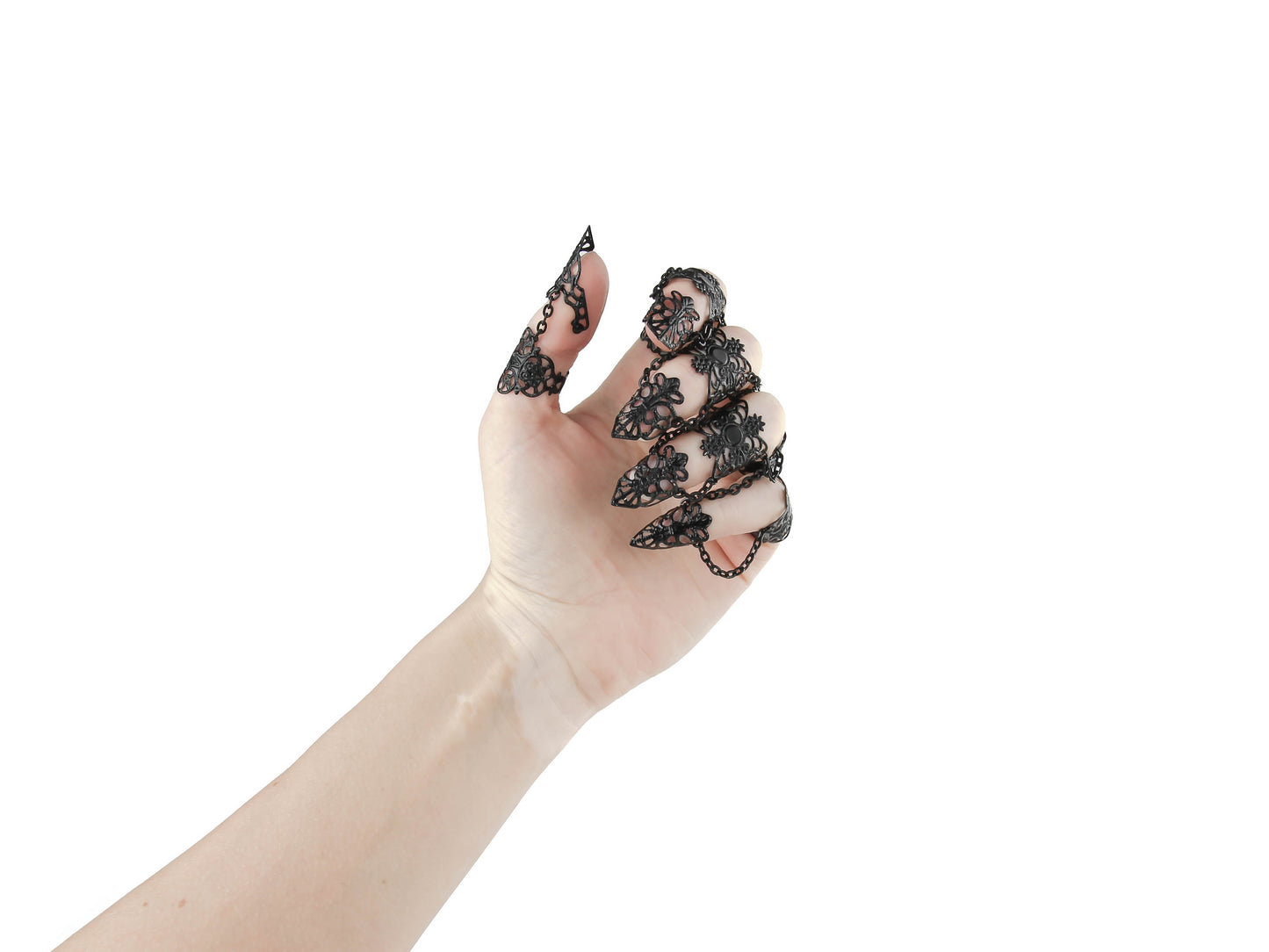 A hand displays a full finger black claw ring set from Myril Jewels, crafted with exquisite detail for a striking neo-goth look. Ideal for lovers of gothic-chic and witchcore styles, these rings add a daring touch to any ensemble, perfect for Halloween, festivals, or as a bold statement piece in everyday goth fashion.