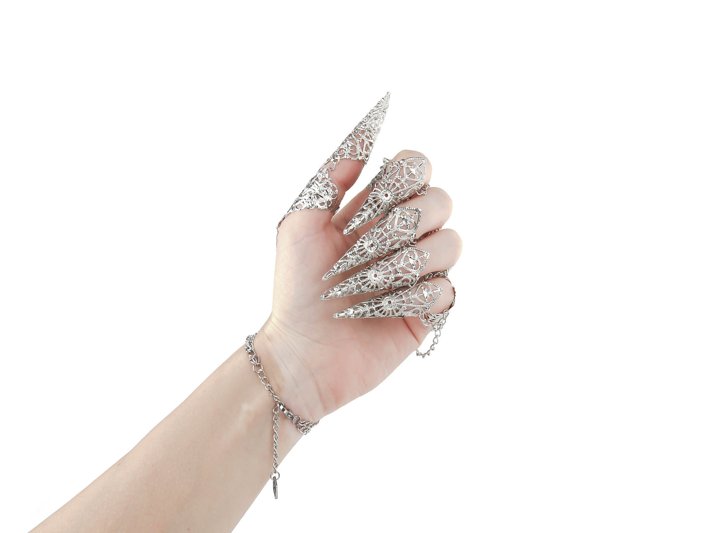 A hand dons a striking metal glove with finger claw rings, intricately designed by Myril Jewels. It's a blend of gothic-chic and neo-goth finesse, perfect for those seeking bold witchcore jewelry to accent their Halloween ensemble or to make a statement at a rave party