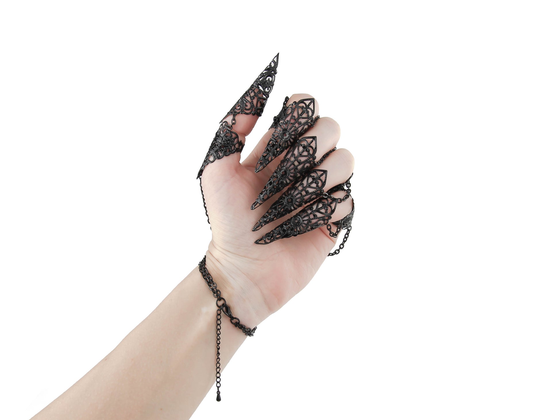 A fashion-forward black metal glove adorned with finger claw rings by Myril Jewels, epitomizing the essence of neo-gothic style. This striking accessory merges dark avant-garde aesthetics with bold, gothic-chic flair, perfect for Halloween, rave parties, or as a unique gift for goth enthusiasts.