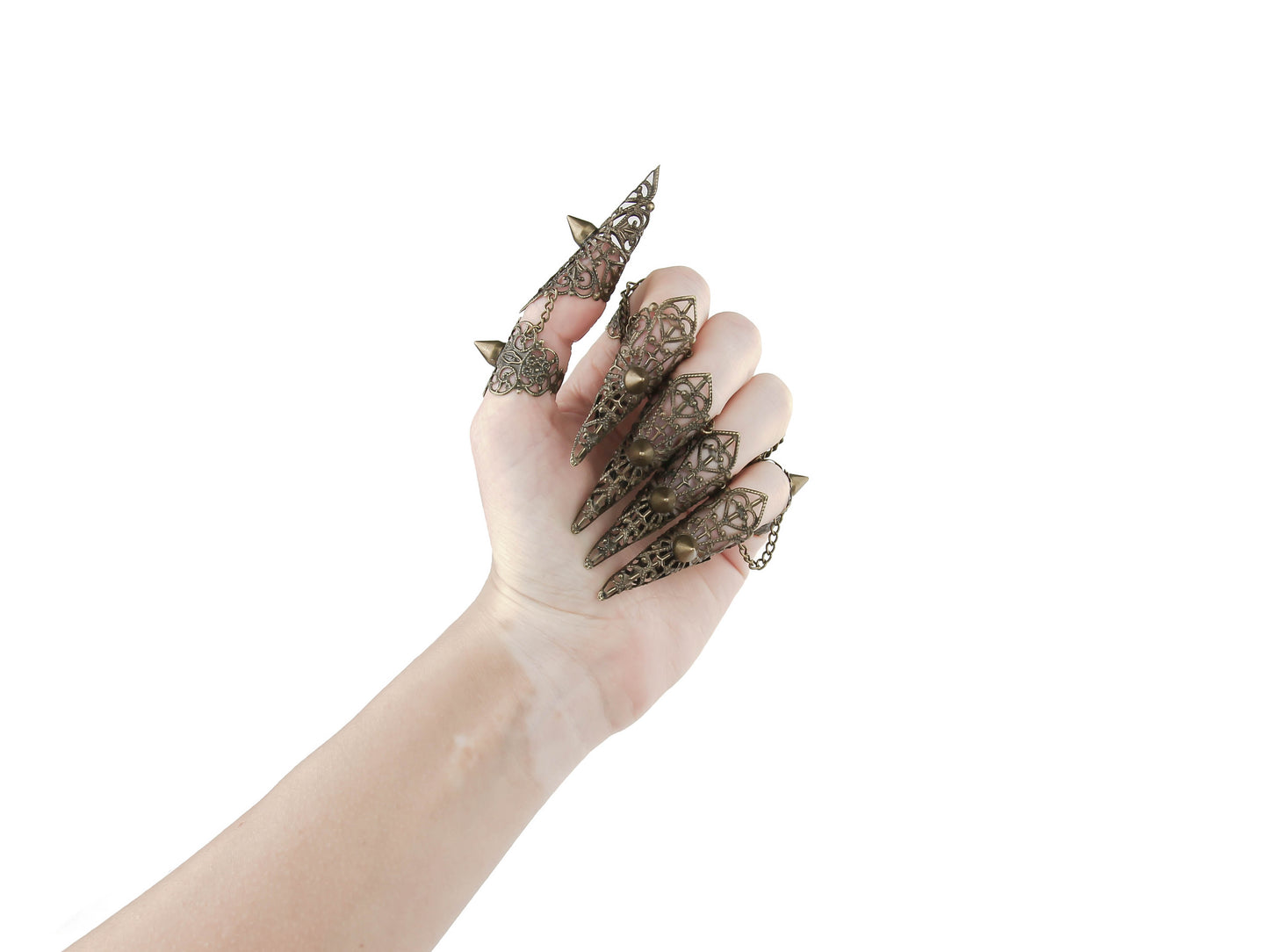 An artistic display of Myril Jewels' bronze claw rings with studs, capturing the essence of neo gothic design. These unique pieces embody the dark avant-garde, suitable for Halloween events, festival wear, or as a bold statement in a gothic-chic wardrobe