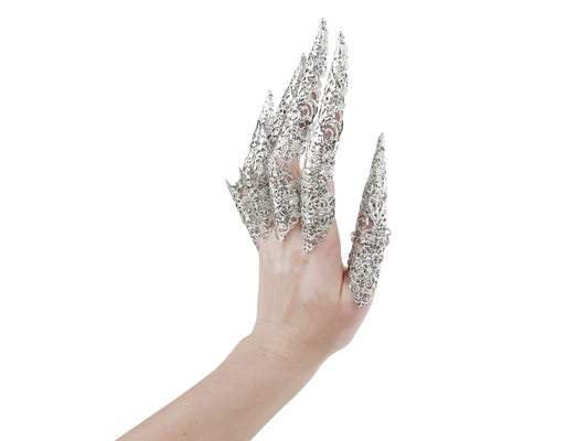 Elegant and edgy hand accessory from Myril Jewels, showcasing a full set of silver full finger claw rings with elongated nail claws, intricately designed for a bold neo gothic look. Ideal for gothic-chic enthusiasts, this handcrafted piece embodies dark avant-garde aesthetics, perfect as a standout Halloween or festival jewel, or a unique goth girlfriend gift.