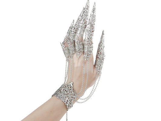 An intricately designed silver metal glove with full finger claw rings by Myril Jewels, embodying the spirit of dark avant-garde fashion. A perfect accessory for goth enthusiasts or a bold statement for festival and rave wear, blending witchcore with neo-gothic craftsmanship