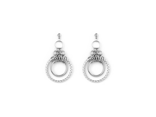 The image displays a pair of polished double hoop earrings with intricate detailing, likely from Myril Jewels. These earrings combine a classic hoop design with a smaller chained hoop, reflecting a modern twist on gothic-inspired jewelry. Ideal for adding an edgy yet sophisticated touch to any outfit, they could be a versatile accessory for Halloween, punk fashion enthusiasts, or anyone drawn to neo-gothic aesthetics. The simple elegance of these earrings makes them suitable for everyday wear