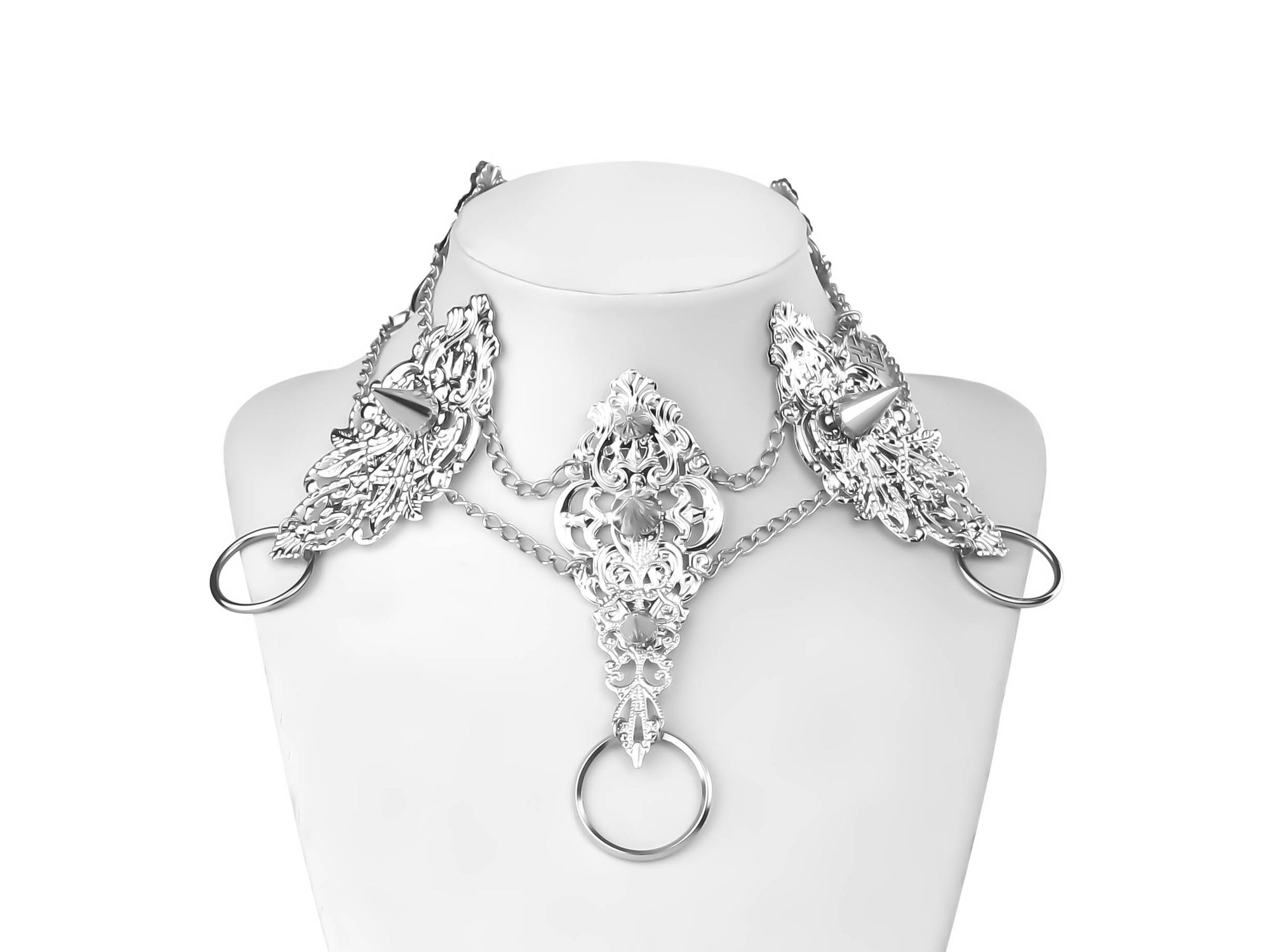 Myril Jewels crafts this striking punk-inspired studded metal choker, a centerpiece for the dark avant-garde jewelry collector. Showcasing intricate metalwork, this piece captures the essence of Neo Gothic design. Ideal for Gothic Lolita, Gothic-chic, and whimsigoth styles, it's a statement piece for Halloween and everyday wear. The choker's bold yet elegant aesthetic makes it a perfect match for those who embrace a minimal goth lifestyle