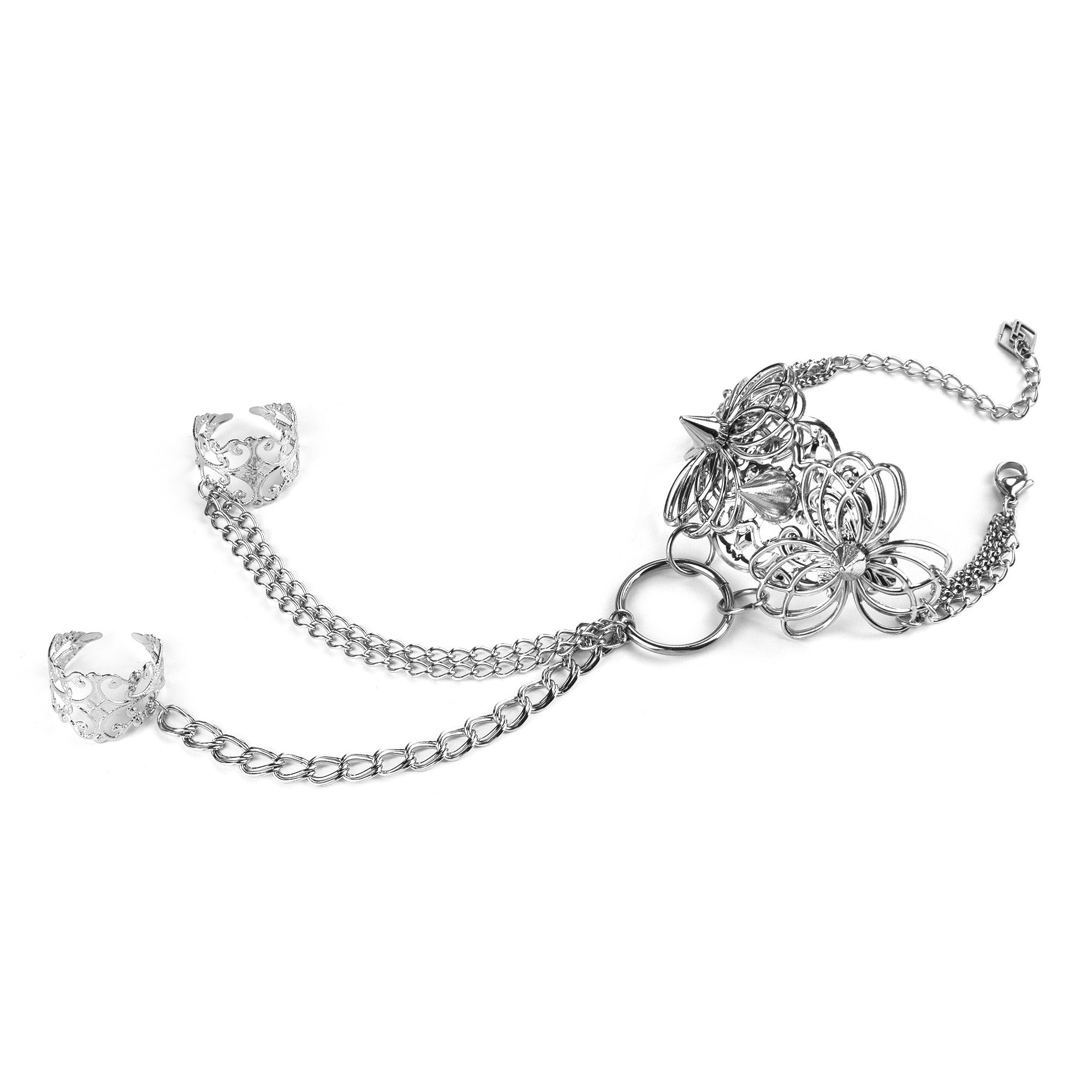 Embody the night with Myril Jewels' punk hand chain bracelet, a fusion of gothic-chic and avant-garde design. Crafted for the dark fashion connoisseur, this piece features intricate filigree work that forms an elegant ring-to-wrist chain, perfect for enhancing a Neo Gothic, Whimsigoth, or minimal goth look. Ideal for festivals, rave parties, or as a statement piece in a Witchcore collection, it's a quintessential Myril Jewel for Halloween and beyond