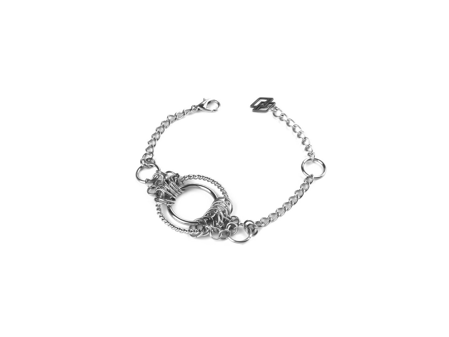 Featuring Myril Jewels' distinctive chainmail-style bracelet, this piece is centered with a prominent o-ring, exemplifying the brand's neo-goth, dark-avantgarde aesthetic. The intricate link design is ideal for adding a touch of gothic-chic to any outfit, making it a versatile choice for Halloween, everyday wear, or as a statement piece for rave parties and festivals. This bracelet is a testament to Myril's commitment to providing unique, handcrafted jewelry for lovers of the gothic and alternative styles.