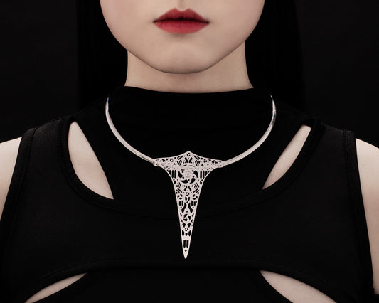  A model wears a Myril Jewels rigid V-shaped necklace, featuring intricate gothic church motifs. This statement piece embodies the essence of neo-gothic elegance and is ideal for those with a love for dark-avantgarde fashion, making it a perfect accessory for Halloween, festivals, or as a distinctive everyday wear piece.