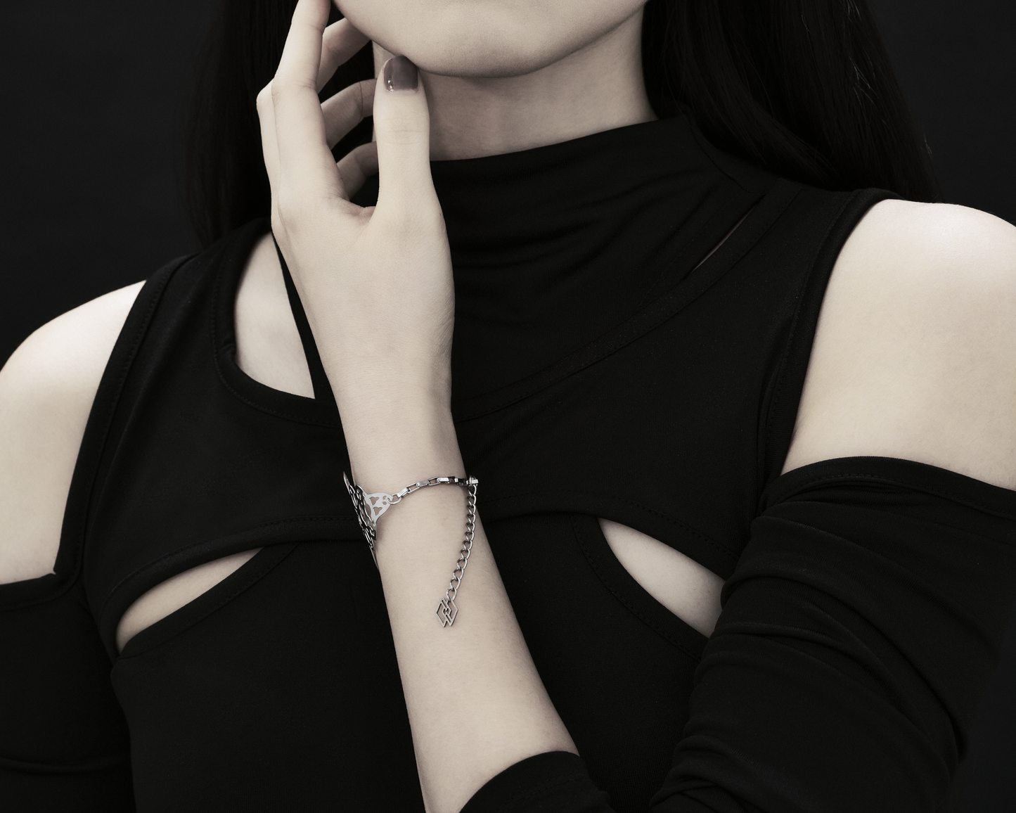 A model poses with a Myril Jewels bracelet, the intricate design inspired by gothic architecture. This sophisticated accessory is ideal for those who appreciate neo-gothic jewelry, adding an avant-garde touch to any ensemble. It’s perfect for goth enthusiasts, adding elegance to everyday wear or special events.
