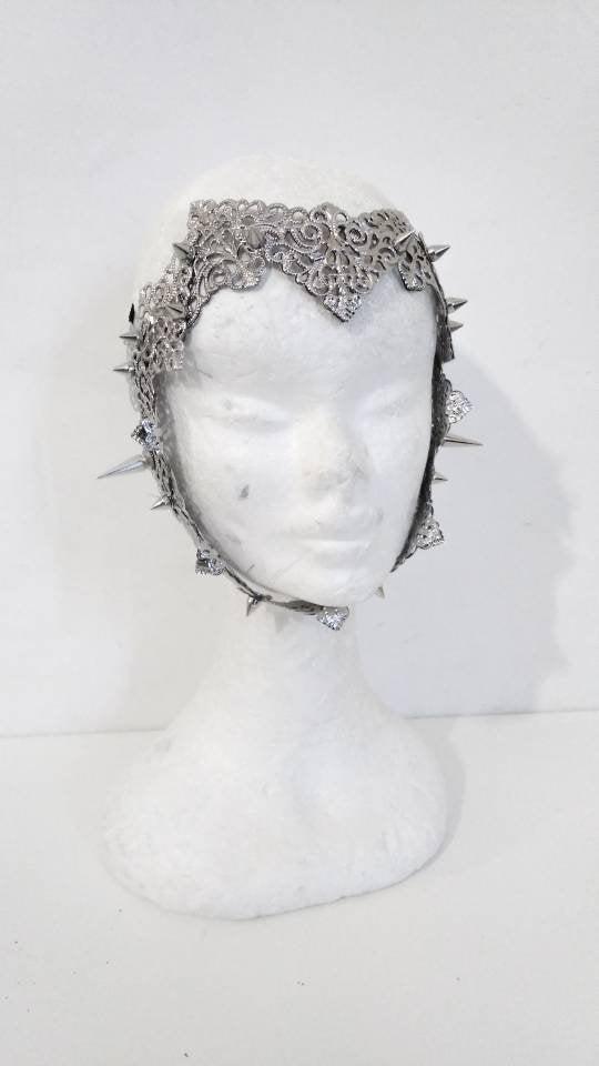 A Myril Jewels punk filigree face frame mask with studs, featuring intricate design details, ideal for a bold neo-gothic statement at festivals or as a unique Halloween accessory.