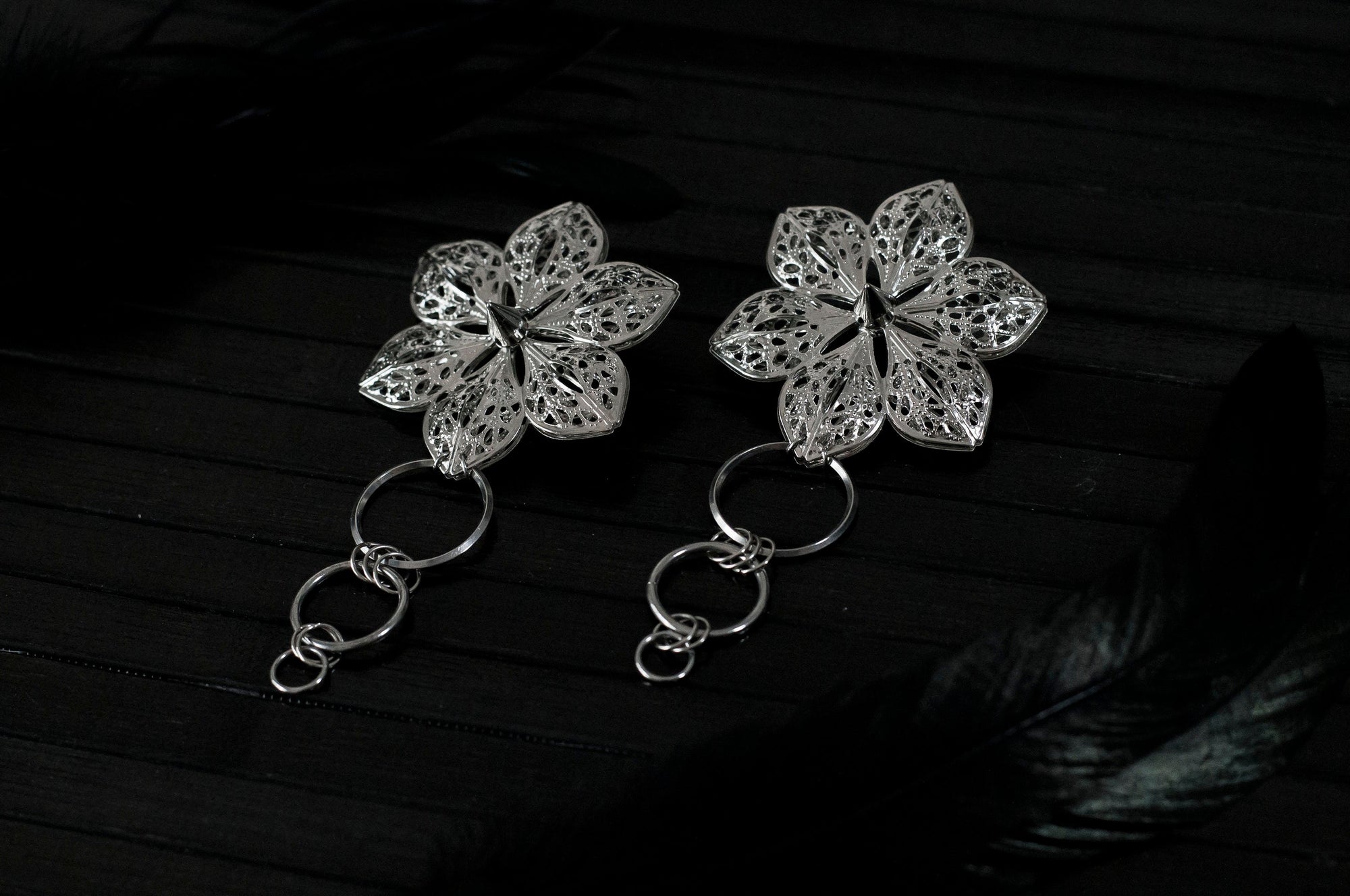 Showcase your unique style with Myril Jewels' punk studded floral earrings, a fusion of dark avant-garde and gothic chic. These handcrafted pieces are perfect for those who admire Neo Gothic elegance and seek a bold accessory for Halloween, whimsigoth, or witchcore attire. With their intricate design, these earrings are also ideal for adding a touch of everyday wear sophistication to any minimal goth wardrobe