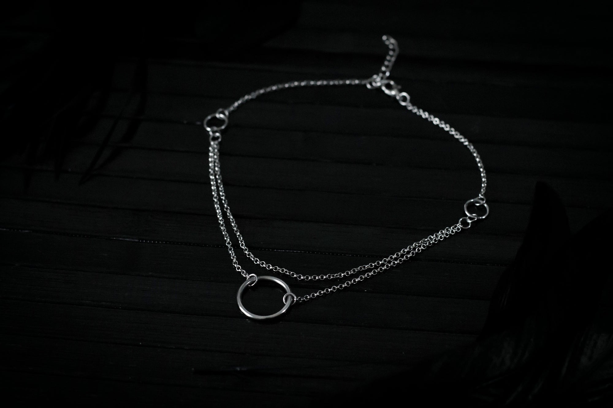 Elegant Myril Jewels chain necklace featuring a minimalist o-ring, ideal for the discerning goth. Perfect for Halloween or everyday wear, this piece blends dark-avantgarde style with subtle punk undertones, making it a unique goth girlfriend gift or a bold addition to a festival ensemble.