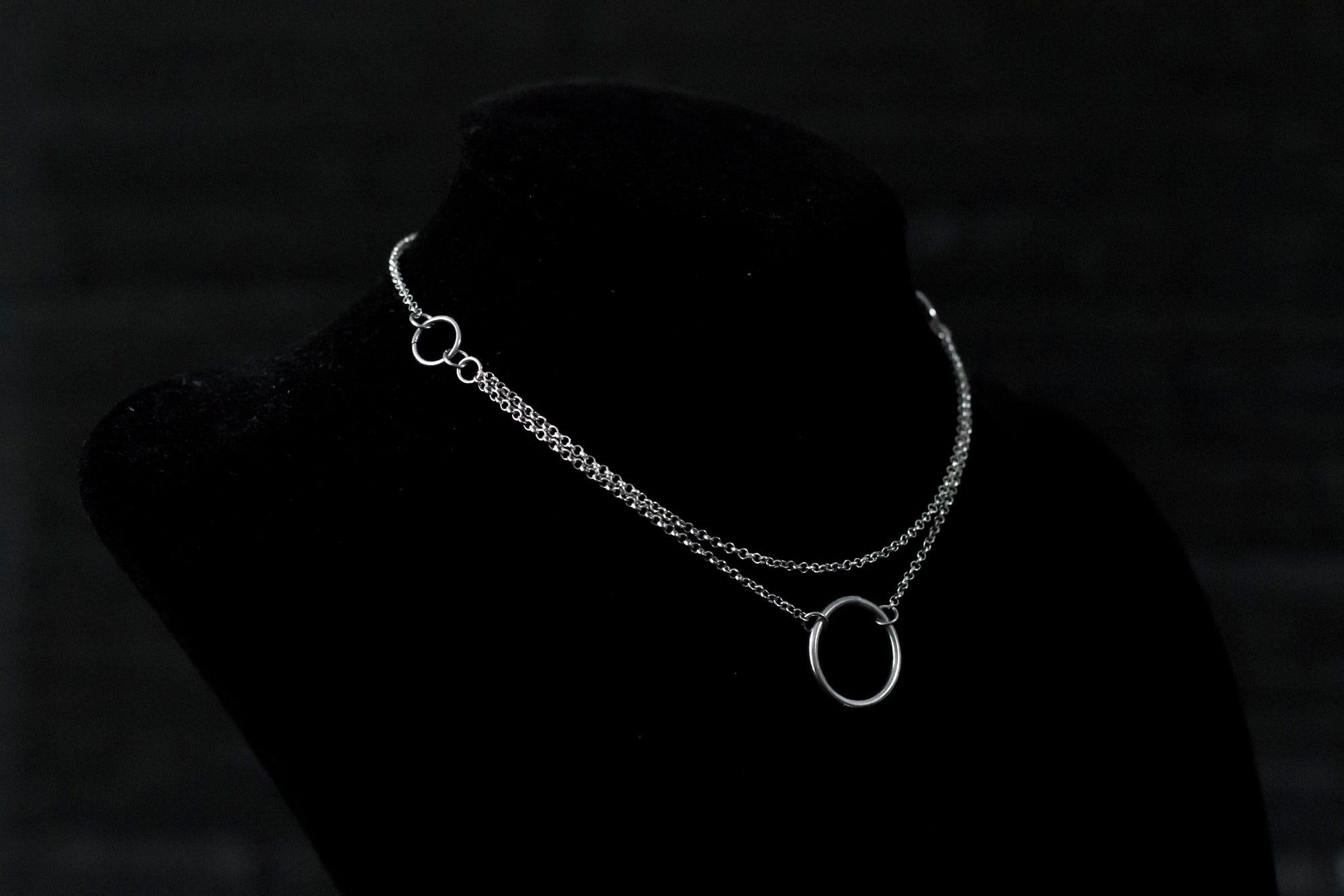 Elegant Myril Jewels chain necklace featuring a minimalist o-ring, ideal for the discerning goth. Perfect for Halloween or everyday wear, this piece blends dark-avantgarde style with subtle punk undertones, making it a unique goth girlfriend gift or a bold addition to a festival ensemble.