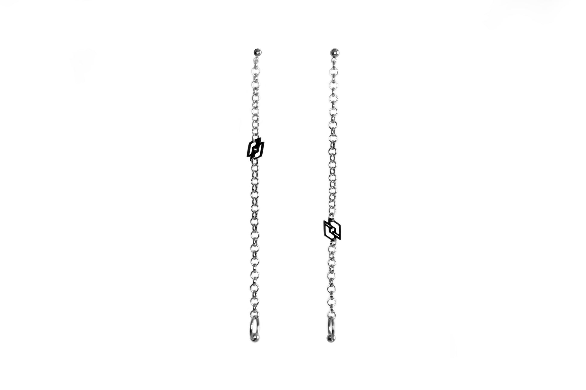 Sleek and edgy, these Myril Jewels long chain earrings feature the distinctive black Myril logo, embodying the spirit of neo-gothic style. Ideal for those who embrace a gothic-chic or whimsigoth aesthetic, these earrings are perfect for Halloween, festivals, or as a bold everyday accessory.
