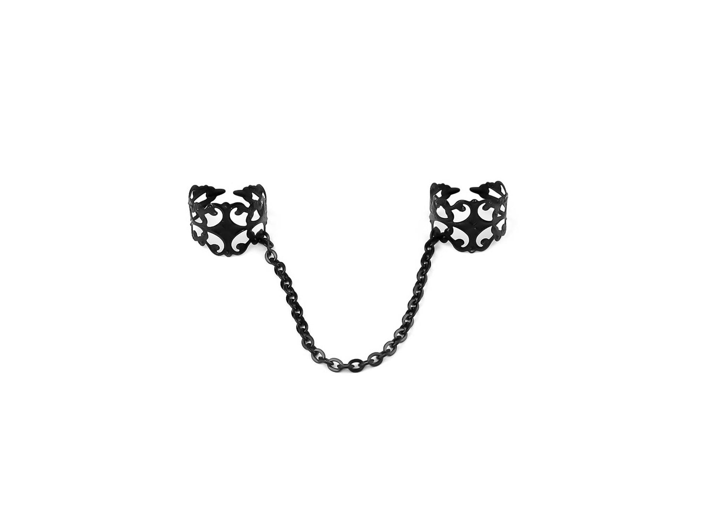 Intricately crafted Myril Jewels black double rings connected by a fine black chain, embodying a dark avant-garde aesthetic for gothic and alternative style enthusiasts. These unique pieces showcase a Neo Gothic charm, ideal for Halloween or Witchcore fashion statements, merging punk edge with Gothic-chic elegance, perfect for those who revel in a whimsigoth and Gothic Lolita inspired look. Handmade in Italy, these double rings represent sophisticated futuristic avant-garde