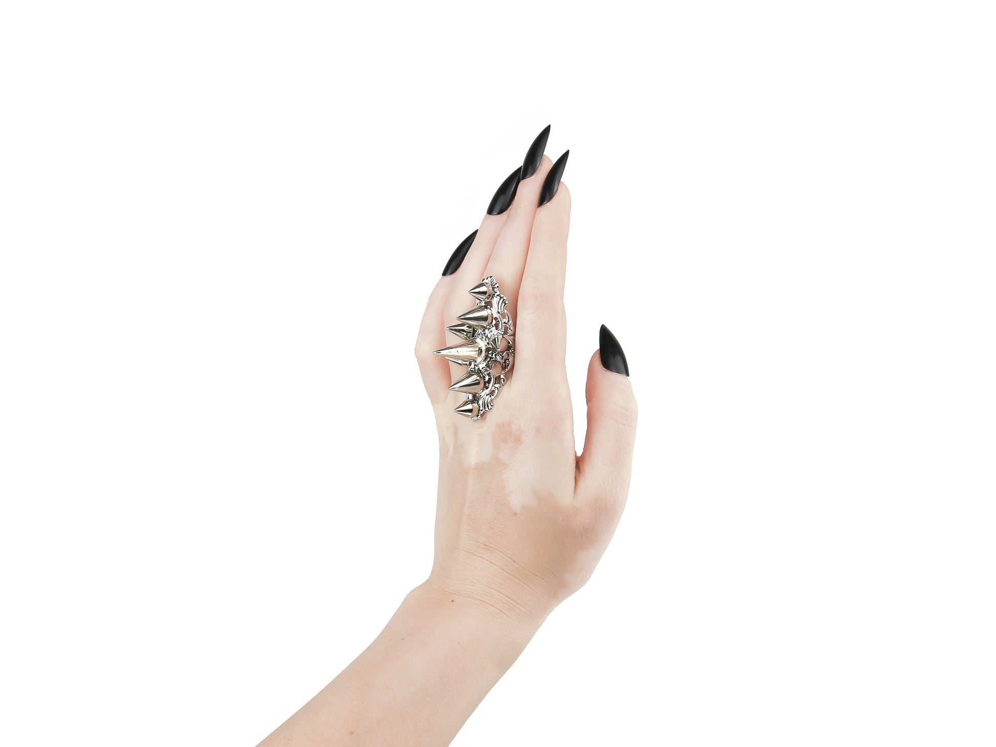 Capture the essence of punk rebellion with Myril Jewels' edgy studded ring. This bold statement piece, with its sharp studs and metallic finish, is a must-have for lovers of dark-avantgarde and gothic accessories. Ideal for Halloween, it also complements everyday minimal goth looks, Witchcore styles, and Gothic-chic ensembles, offering a versatile addition to any Neo Gothic jewel collection