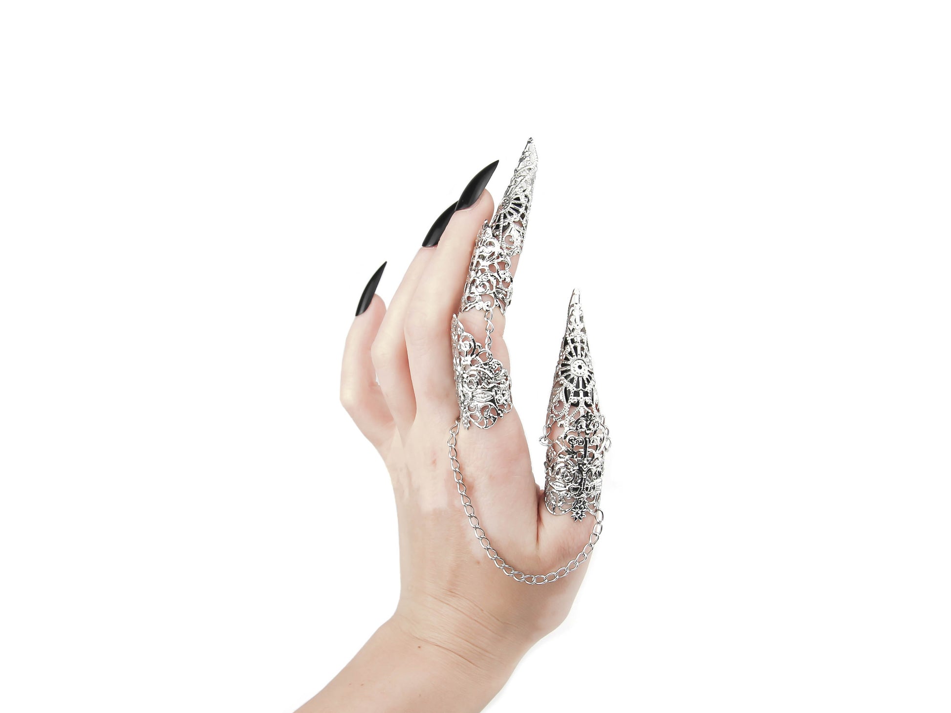 A hand elegantly displays Myril Jewels' gothic full-finger double rings, adorned with intricate silver filigree claws that encapsulate the essence of dark-avantgarde design. This striking piece of claw rings is a hallmark of neo-gothic jewelry, seamlessly blending with the wearer's black manicure to appeal to enthusiasts of gothic-chic, whimsigoth, and witchcore styles. It's an audacious choice for those seeking a bold statement at Halloween events, rave parties