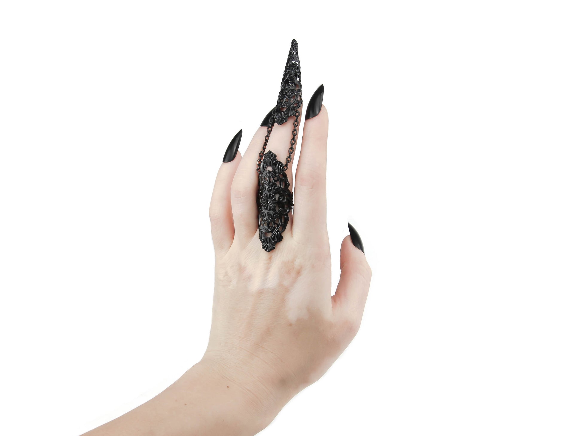 This image captures a striking black claw ring from Myril Jewels, elegantly worn on the middle finger. The ring's intricate, dark design epitomizes the brand's neo-goth aesthetic, perfect for Halloween, punk styles, and witchcore enthusiasts. It's an ideal piece for gothic-chic expressions, rave parties, or as a bold jewelry choice for everyday wear, making it a unique goth girlfriend gift or a daring accessory for anyone who loves standout, handcrafted jewelry.