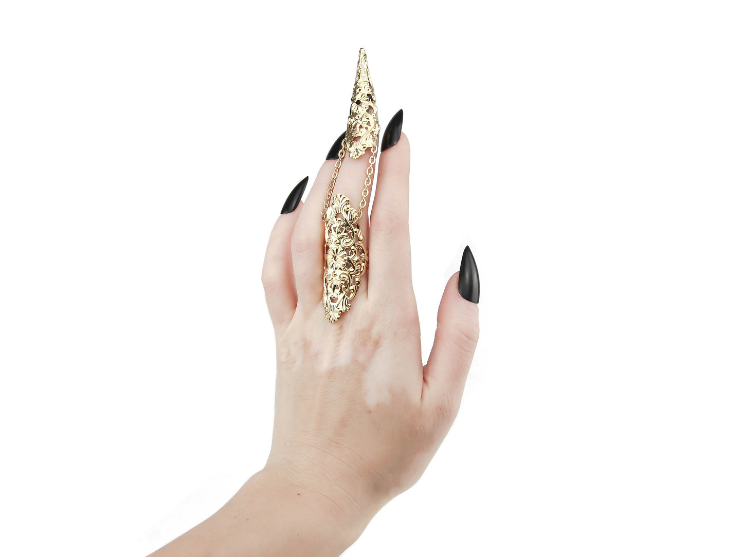 This image features a striking gold claw ring from Myril Jewels, worn on the middle finger and embodying the brand's signature dark avant-garde style. The claw ring is a quintessential piece for gothic and alternative fashion lovers, ideal for Halloween, embodying punk jewelry aesthetics, and a perfect expression of gothic-chic and whimsigoth trends. It’s a bold addition to any ensemble, from everyday wear to festival gear, and a unique goth girlfriend gift.