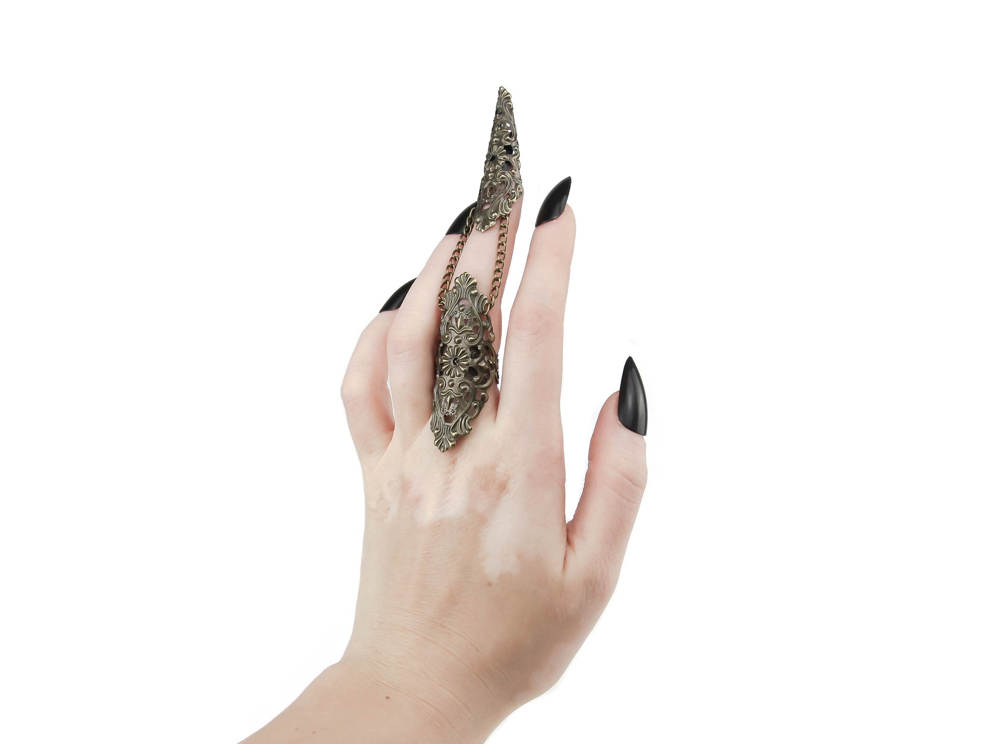A dramatic bronze claw ring from Myril Jewels adorns the middle finger, embodying the essence of neo-goth style. This dark, avant-garde piece is a perfect expression for Halloween, punk styles, and witchcore enthusiasts, enhancing any gothic-chic or minimal goth ensemble. Ideal for everyday wear, rave parties, and festivals, it's a bold jewelry choice and a thoughtful gift for a goth girlfriend.