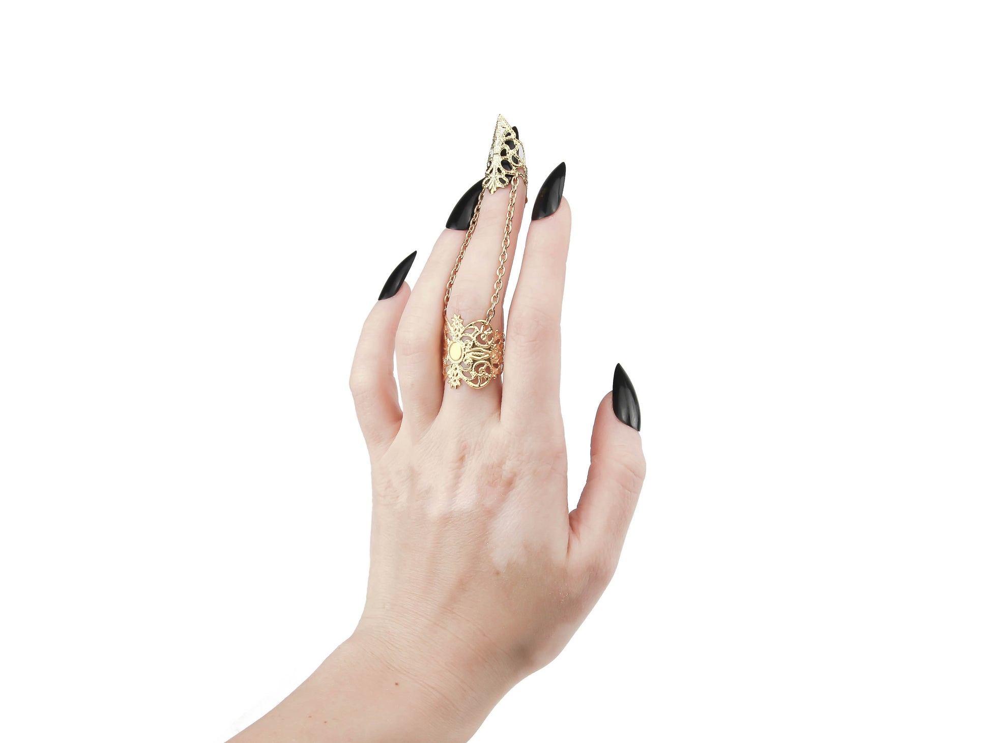 This image features a striking gold claw ring from Myril Jewels, worn on the middle finger and embodying the brand's signature dark avant-garde style. The claw ring is a quintessential piece for gothic and alternative fashion lovers, ideal for Halloween, embodying punk jewelry aesthetics, and a perfect expression of gothic-chic and whimsigoth trends. It’s a bold addition to any ensemble, from everyday wear to festival gear, and a unique goth girlfriend gift.