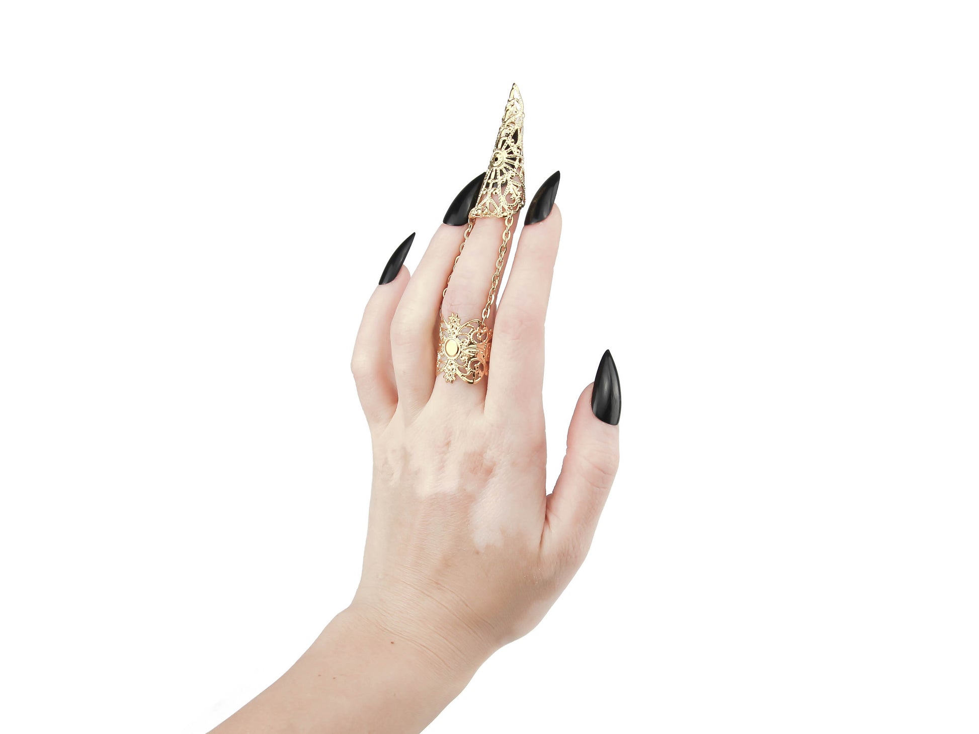 This image features a striking gold claw ring from Myril Jewels, worn on the middle finger and embodying the brand's signature dark avant-garde style. The claw ring is a quintessential piece for gothic and alternative fashion lovers, ideal for Halloween, embodying punk jewelry aesthetics, and a perfect expression of gothic-chic and whimsigoth trends. It’s a bold addition to any ensemble, from everyday wear to festival gear, and a unique goth girlfriend gift.