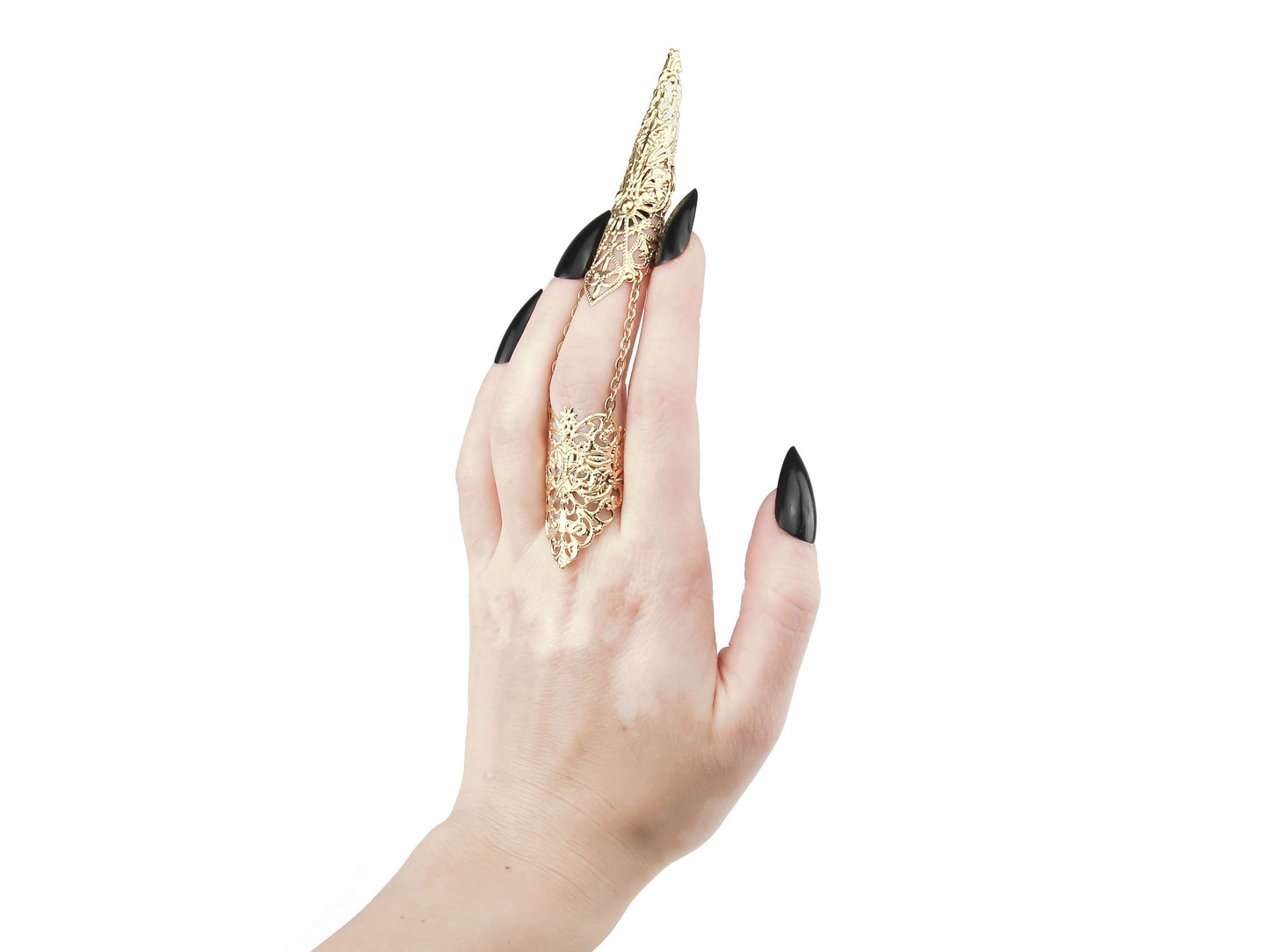 A hand is elegantly adorned with a Myril Jewels full finger gold claw ring, crafted with exquisite filigree detailing. This statement piece from the neo-goth jewelry collection is designed for lovers of dark-avantgarde and gothic-alternative styles. It's an ideal accessory for adding a dramatic flair to Halloween costumes, punk wardrobes, or drag queen ensembles, and it suits everyday wear as well as rave parties and festivals for those who embrace whimsigoth or witchcore aesthetics