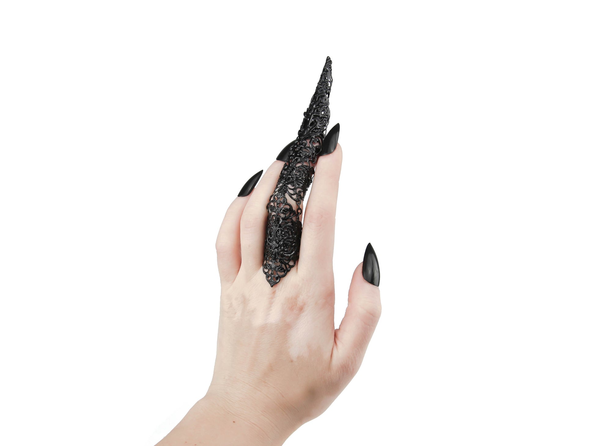 A single, detailed full-finger black claw ring with a sharp long nail claw adorns a hand, embodying the dark avant-garde flair of Myril Jewels. This piece is a bold testament to neo gothic style, making it a quintessential selection for those seeking gothic-chic or Halloween jewelry. Perfect as a statement accessory for drag queen performances, rave parties, or as a unique goth girlfriend gift