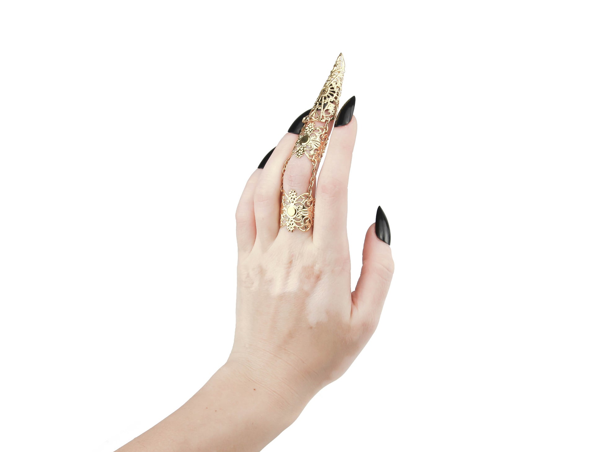 Discover the fusion of elegance and edge with Myril Jewels' signature dark-avantgarde armor ring in gold, expertly crafted for the chic gothic aficionado. This statement piece, designed to resemble a sleek claw, is an essential accessory for those who embody the Neo Gothic and Witchcore lifestyle. Perfect for Halloween or as a daring touch to everyday minimal goth attire, this ring is a standout addition to any Punk, Gothic Lolita, or Gothic-chic ensemble