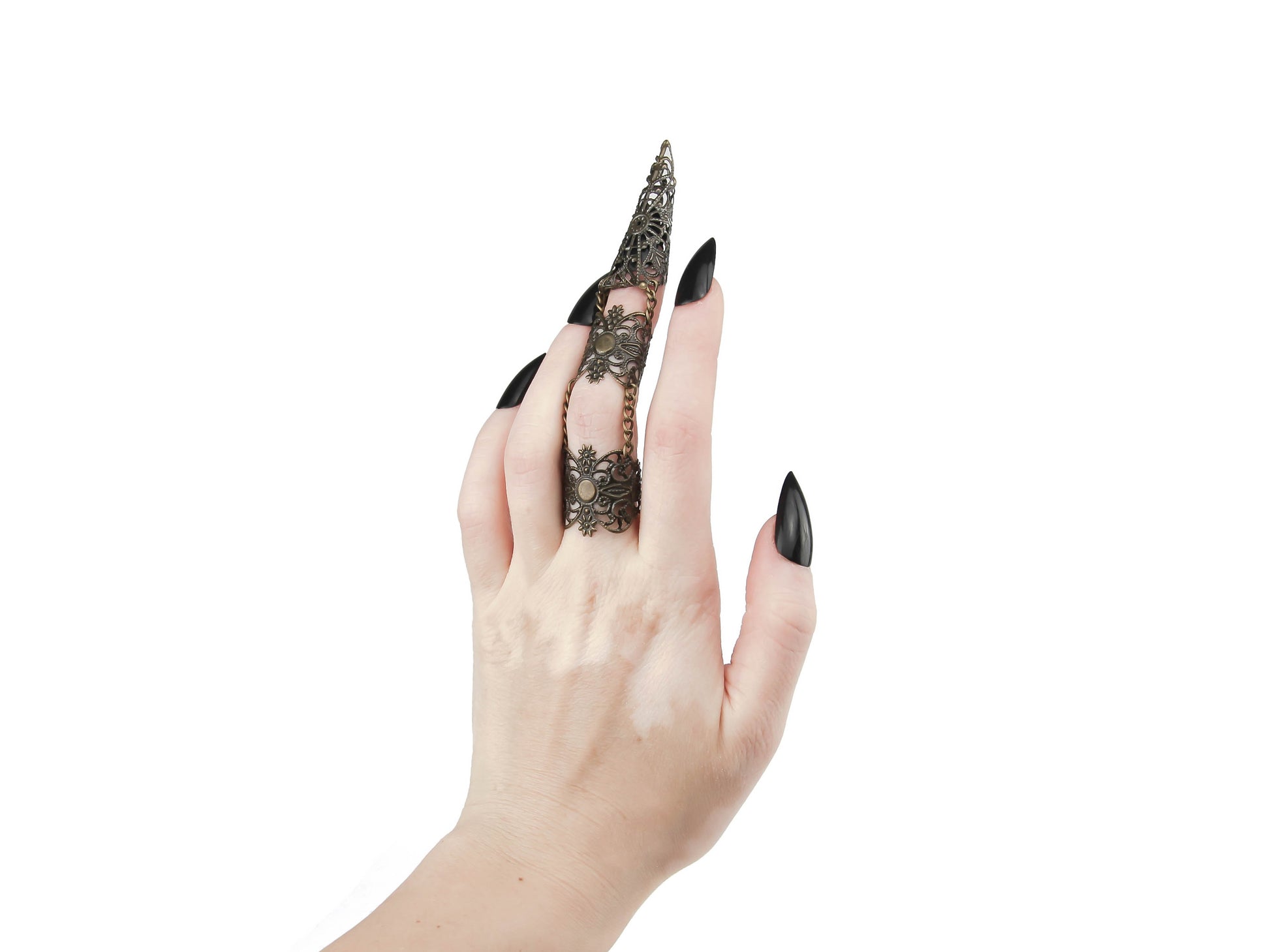 Experience the fusion of elegance and edge with Myril Jewels' handcrafted bronze claw ring, a statement piece for the dark-avantgarde enthusiast. This unique armor-like ring with a claw design is perfectly tailored for the middle finger, crafted to complement a range of styles from Gothic Lolita to Witchcore. Ideal for Halloween Jewelry collections, its bold aesthetic also suits everyday wear for those who embody the minimal goth spirit