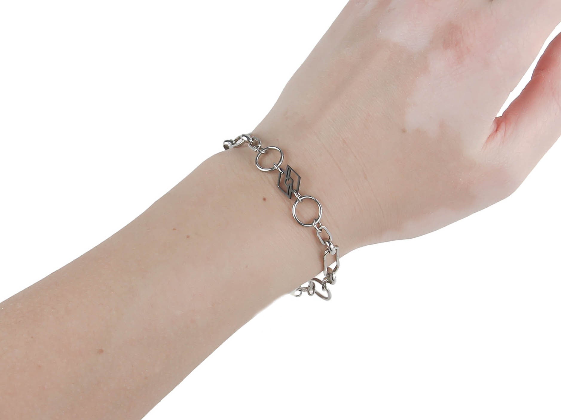 Myril Jewels' signature chain bracelet adorns the wrist in a display of neo-gothic charm, seamlessly blending with both whimsigoth and everyday minimal goth styles. This Italian-designed, handcrafted piece is a staple for gothic-chic and alternative fashion connoisseurs, offering a versatile accessory for Halloween and beyond. Its sleek design makes it a must-have for those with a penchant for dark avant-garde elegance