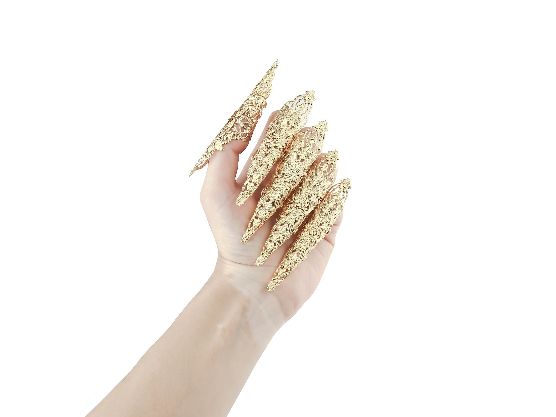 Showcasing Myril Jewels' signature full hand set of extra-long gold nail claw rings, this image captures the essence of neo-gothic finesse. Ideal for those embracing gothic-chic, whimsigoth, or witchcore styles, these claws make for an unforgettable accessory for Halloween, festivals, or as a striking gift.