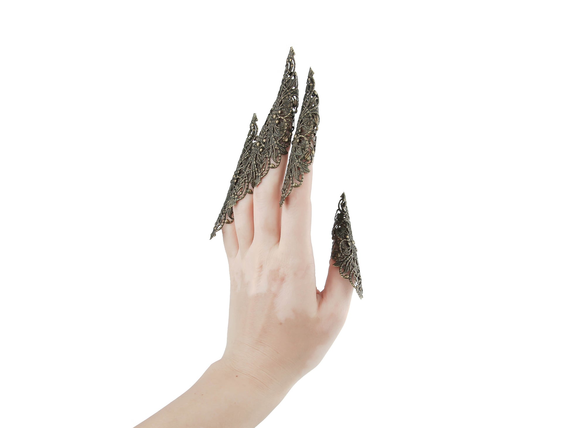 A striking full hand set of extra-long nail claw rings by Myril Jewels, crafted for the neo-goth jewelry lover. These claws embody a dark avant-garde aesthetic, perfect for Halloween, gothic-chic events, or as a bold accessory for everyday wear by those who embrace a witchcore or whimsigoth style.