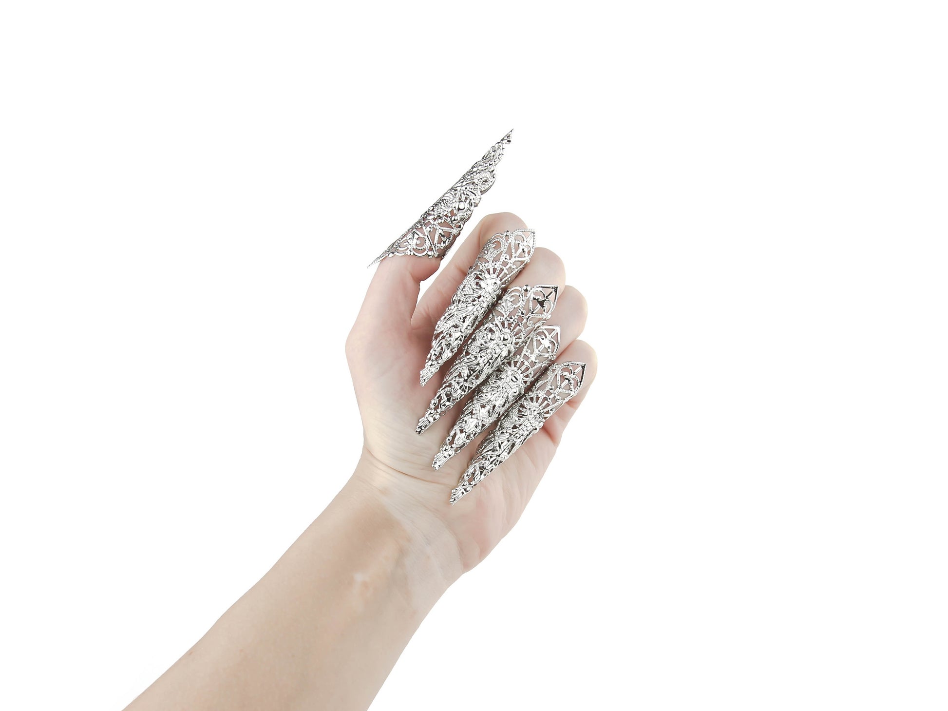 A full hand set of Myril Jewels' extra long nail claw rings create an impactful neo-gothic statement. These claws are the epitome of dark avant-garde jewelry, perfect for gothic enthusiasts seeking bold, witchcore-inspired accessories for everyday wear, Halloween, or festival outfits