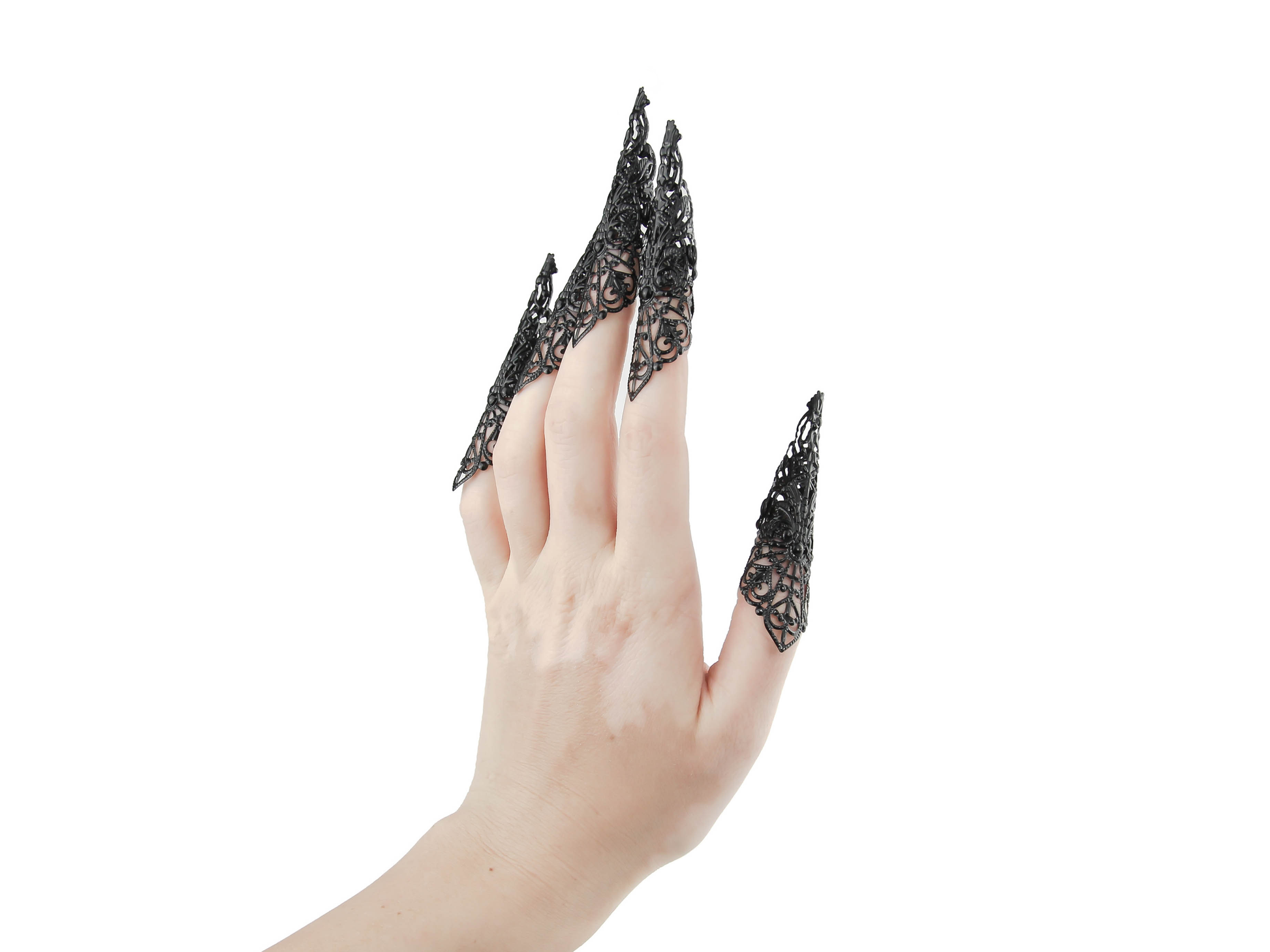 A full hand set of extra-long black nail claws by Myril Jewels showcases a bold neo-goth design, ideal for anyone with a love for dark, statement jewelry. Perfect for Halloween or as a standout accessory at a rave party, these claws encapsulate gothic-chic and witchcore styles, making them a unique gift for the goth girlfriend or for dramatic festival wear.