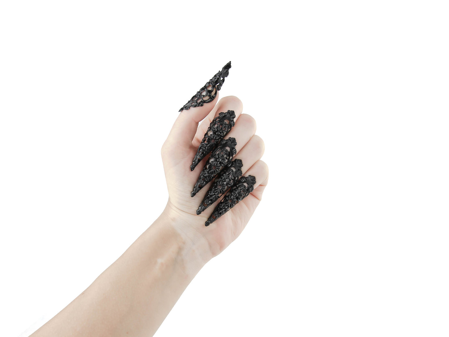 Chic goth black nail rings from Myril Jewels, intricately designed as black claws for a striking neo-gothic statement. Ideal for fashion-forward individuals, these pieces serve as the perfect accessory for everyday wear or as a bold highlight to a minimal goth, witchcore, or festival look, also making them great goth girlfriend gift ideas.