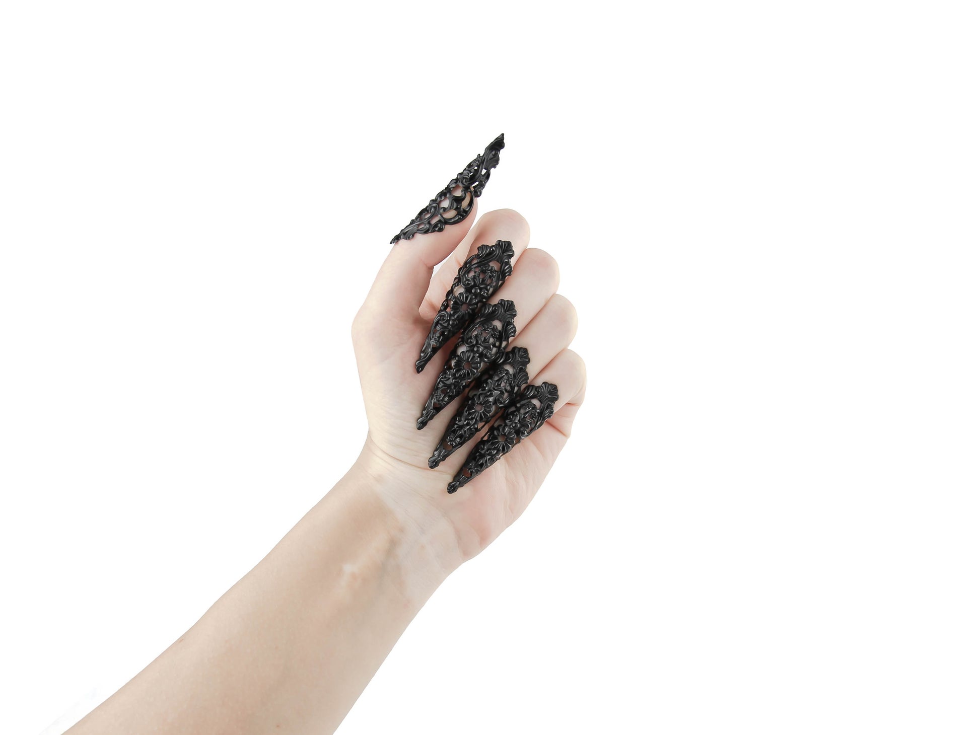 Chic goth black nail rings from Myril Jewels, intricately designed as black claws for a striking neo-gothic statement. Ideal for fashion-forward individuals, these pieces serve as the perfect accessory for everyday wear or as a bold highlight to a minimal goth, witchcore, or festival look, also making them great goth girlfriend gift ideas.