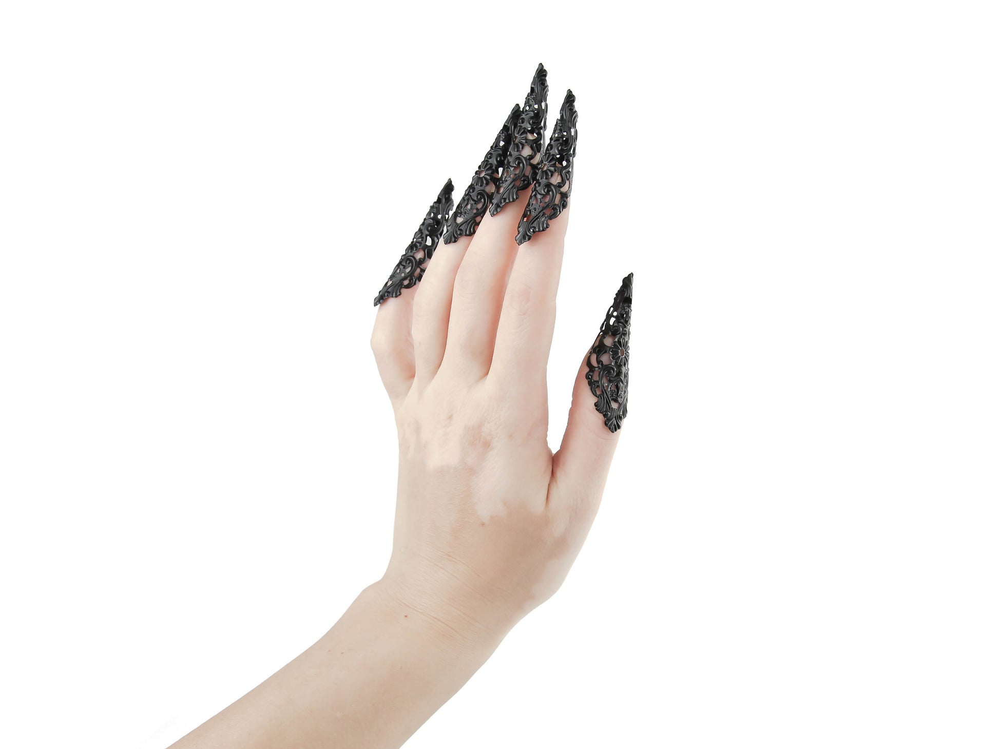 Chic goth black nail rings from Myril Jewels, intricately designed as black claws for a striking neo-gothic statement. Ideal for fashion-forward individuals, these pieces serve as the perfect accessory for everyday wear or as a bold highlight to a minimal goth, witchcore, or festival look, also making them great goth girlfriend gift ideas.