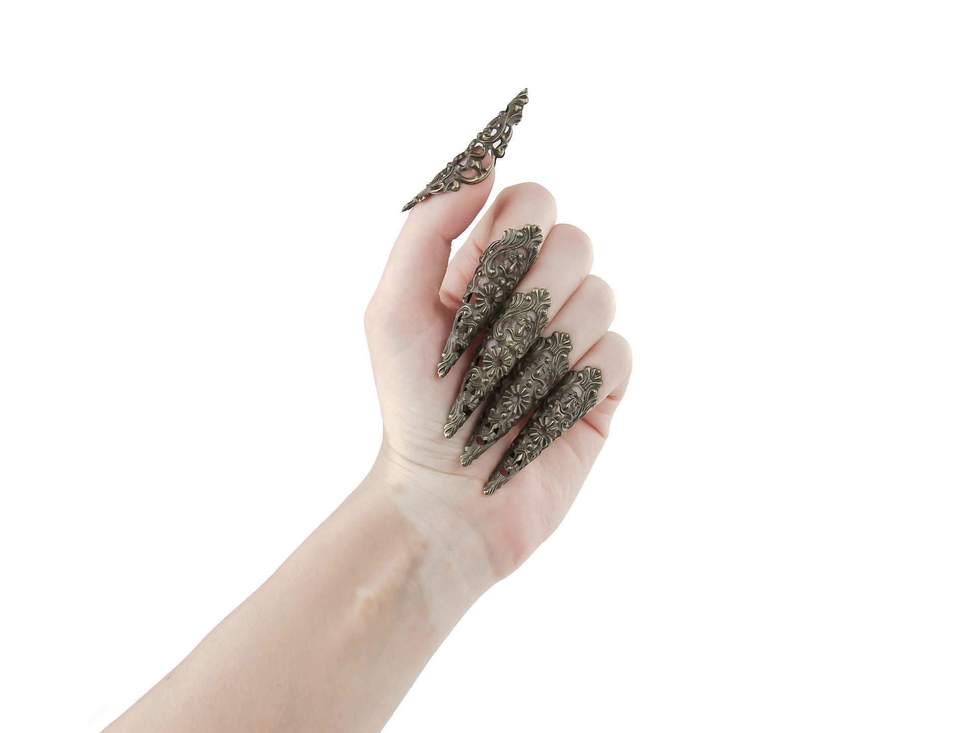 Delicate yet daring, these gothic nail jewels in bronze from Myril Jewels redefine statement accessories. Dubbed as claws, they’re perfect for a neo-goth look, complementing Halloween outfits, punk styles, and everyday whimsigoth fashion. These intricate pieces are not just jewelry, but wearable art for witchcore enthusiasts and a bold choice for anyone seeking to make an impression at raves or festivals, or as a striking goth girlfriend gift.