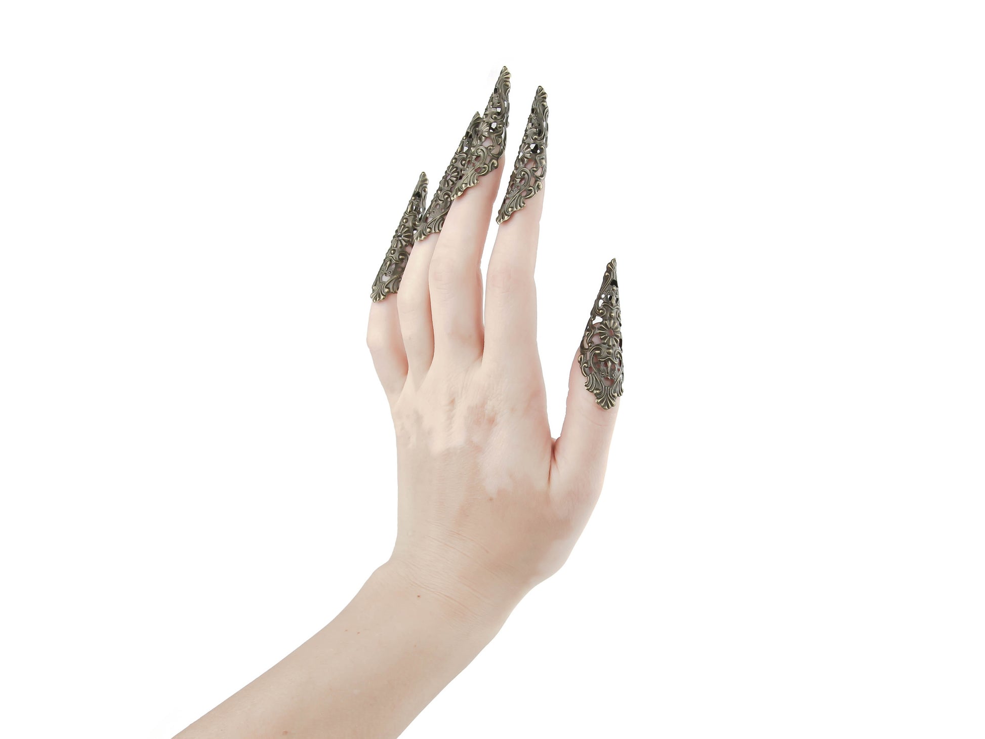 Delicate yet daring, these gothic nail jewels in bronze from Myril Jewels redefine statement accessories. Dubbed as claws, they’re perfect for a neo-goth look, complementing Halloween outfits, punk styles, and everyday whimsigoth fashion. These intricate pieces are not just jewelry, but wearable art for witchcore enthusiasts and a bold choice for anyone seeking to make an impression at raves or festivals, or as a striking goth girlfriend gift.