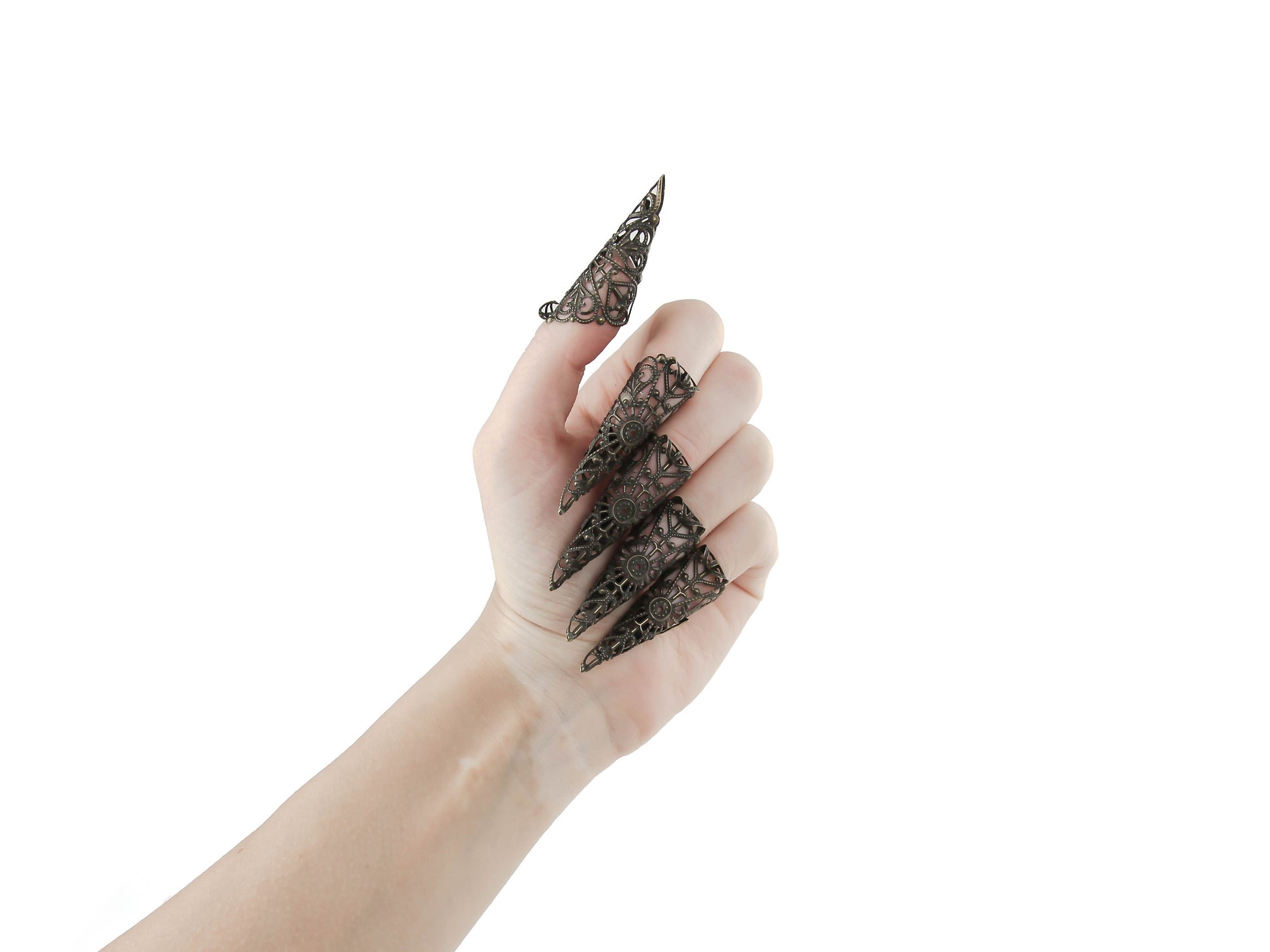 A hand is adorned with a full set of Myril Jewels bronze nail claw jewelry, each piece crafted with exquisite filigree. The claws showcase an elegant neo-goth style, perfect for dark-avantgarde enthusiasts. This bold statement set is ideal for adding a gothic-chic edge to any outfit, suitable for Halloween, whimsigoth and witchcore fashion, and makes a dramatic accessory for everyday wear, rave parties, and festival events.